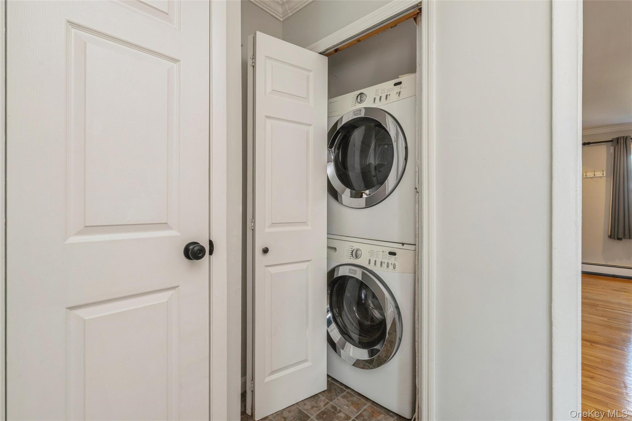 92 Cardinal Lane, Unit 92 Islip, NY 11751 - Photo 7 of 36 a view of a hallway with washer and dryer