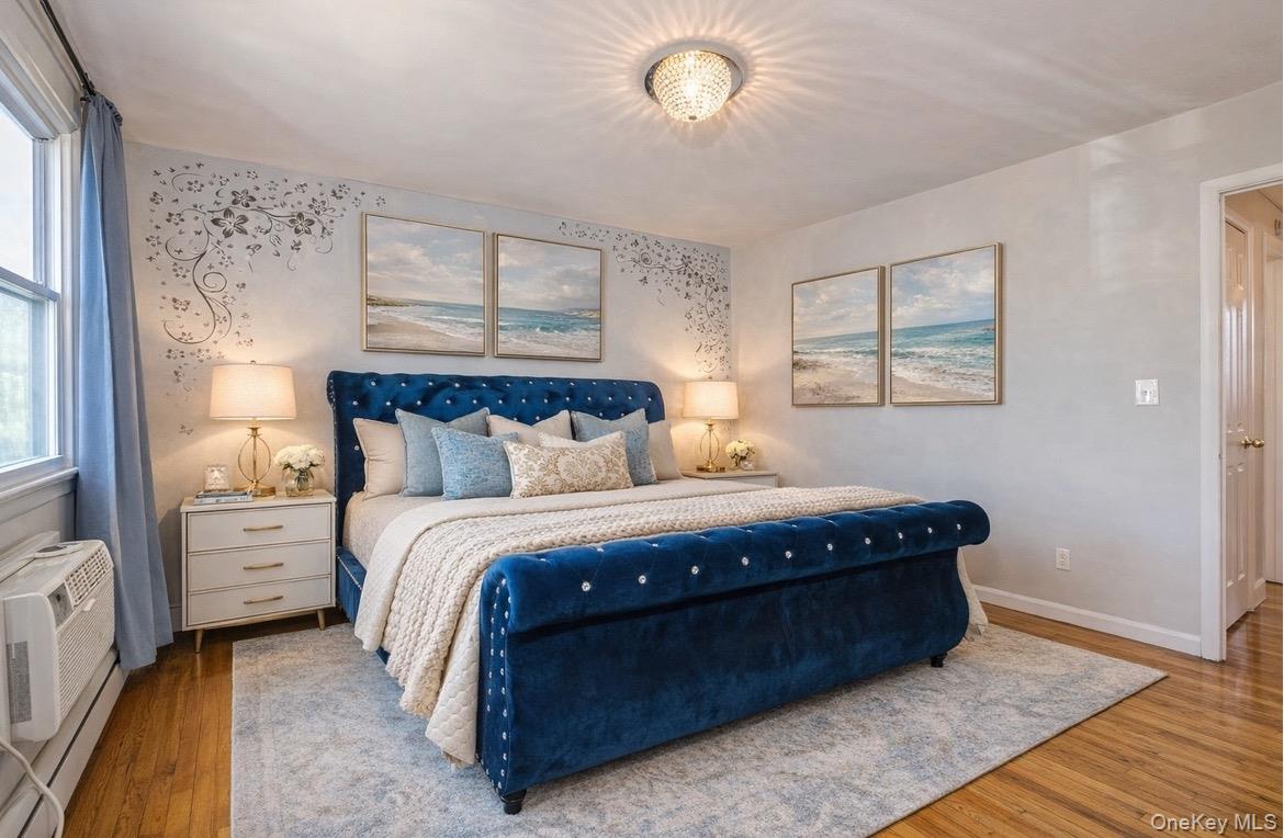 92 Cardinal Lane, Unit 92 Islip, NY 11751 - Photo 10 of 36 a bed sitting in a bedroom next to a window
