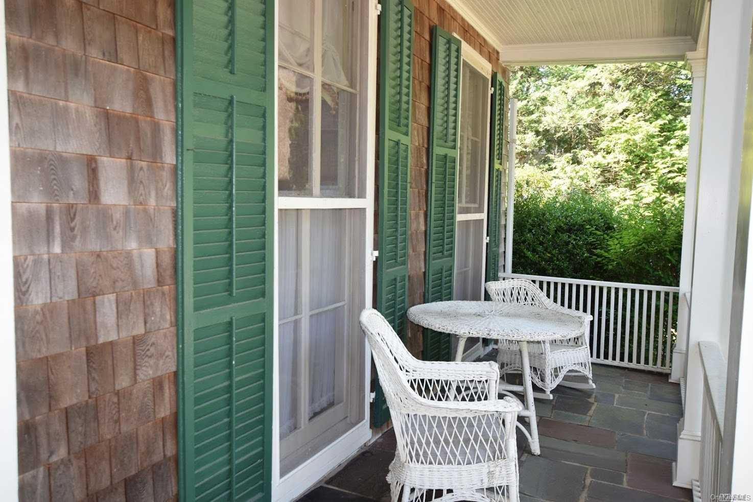 180 South Country Road Bellport, NY 11713 - Photo 1 of 1 a view of a balcony with furniture