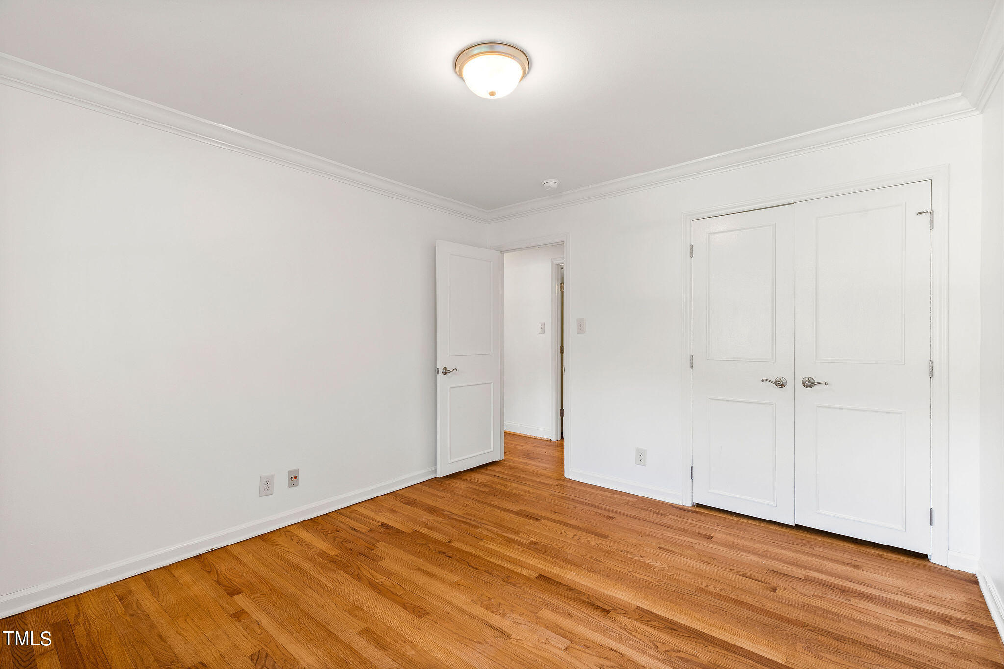 6131 Yellowstone Drive Durham, NC 27713 - Photo 17 of 29 a view of empty room with wooden floor