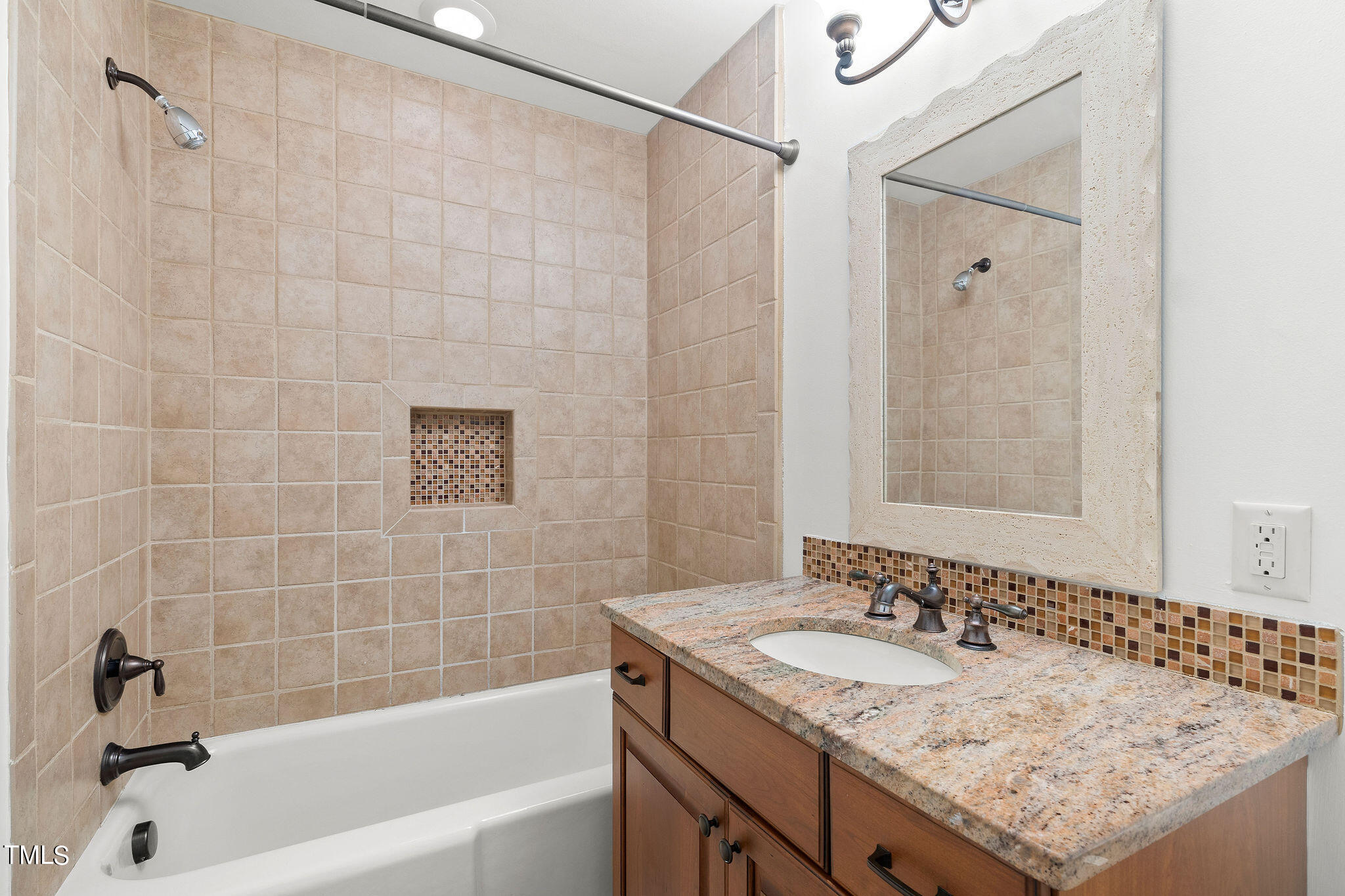 6131 Yellowstone Drive Durham, NC 27713 - Photo 21 of 29 a bathroom with a granite countertop sink and a bathtub