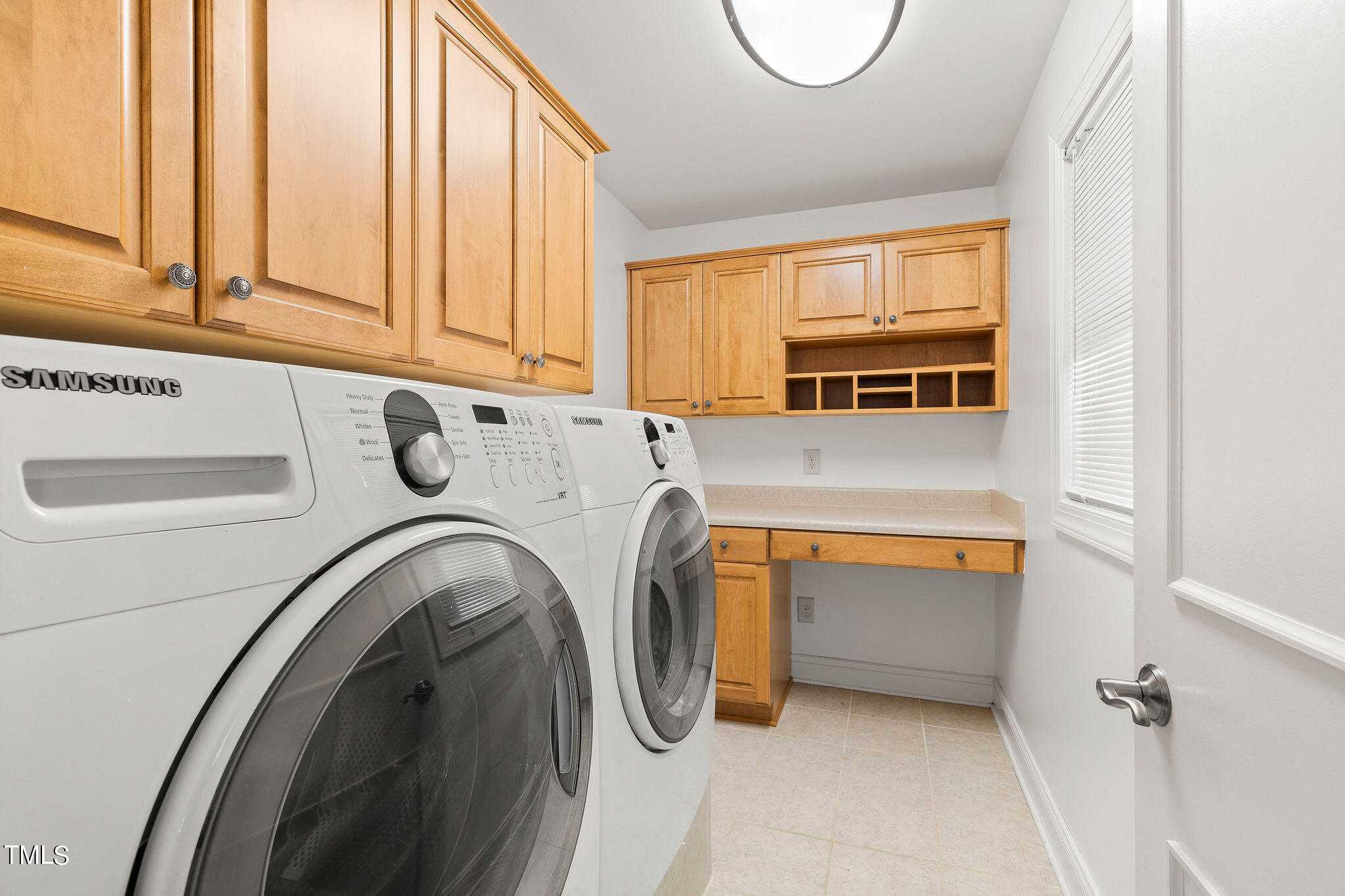 6131 Yellowstone Drive Durham, NC 27713 - Photo 6 of 29 a utility room with dryer and washer