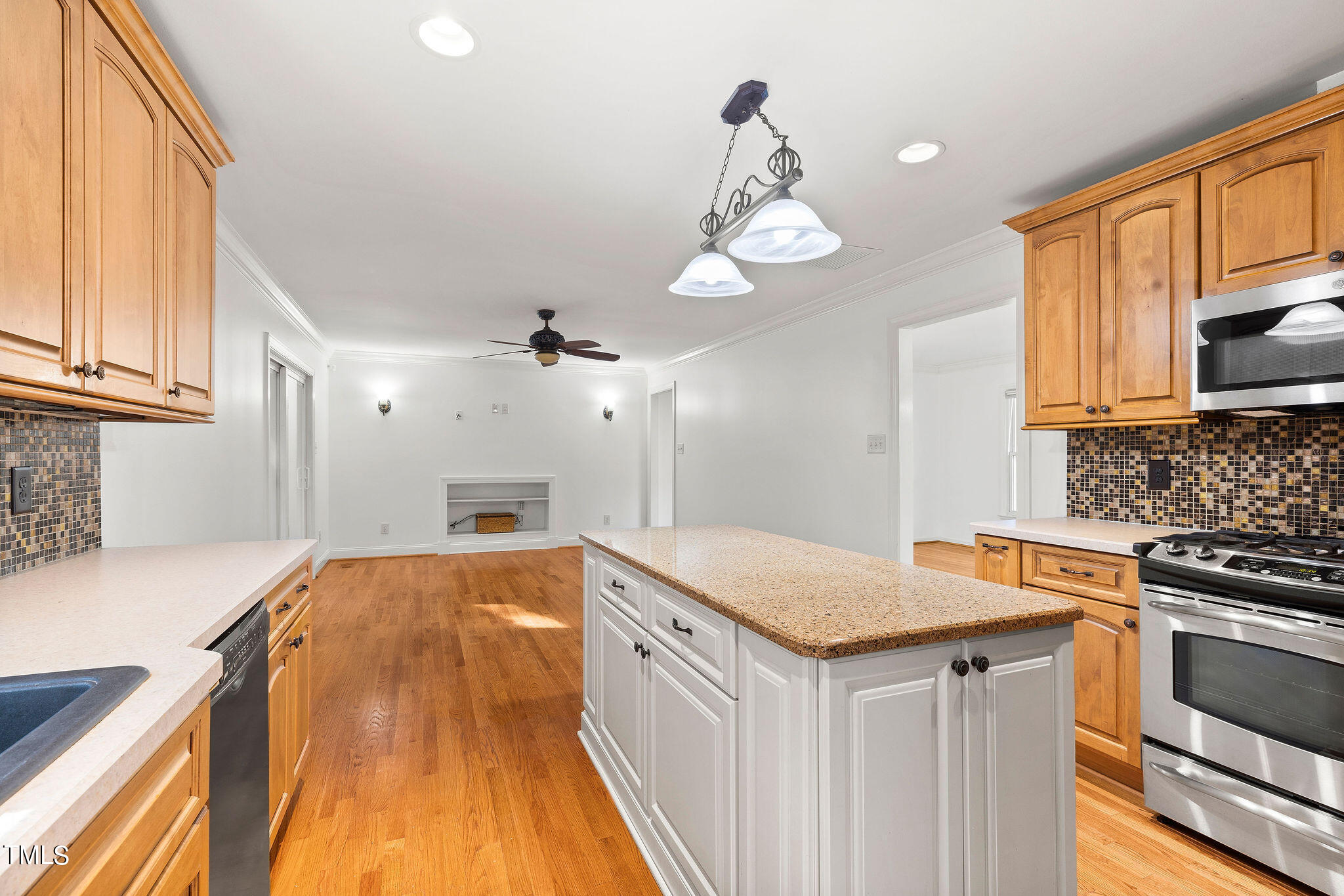 6131 Yellowstone Drive Durham, NC 27713 - Photo 9 of 29 a kitchen with granite countertop a sink cabinets and stainless steel appliances