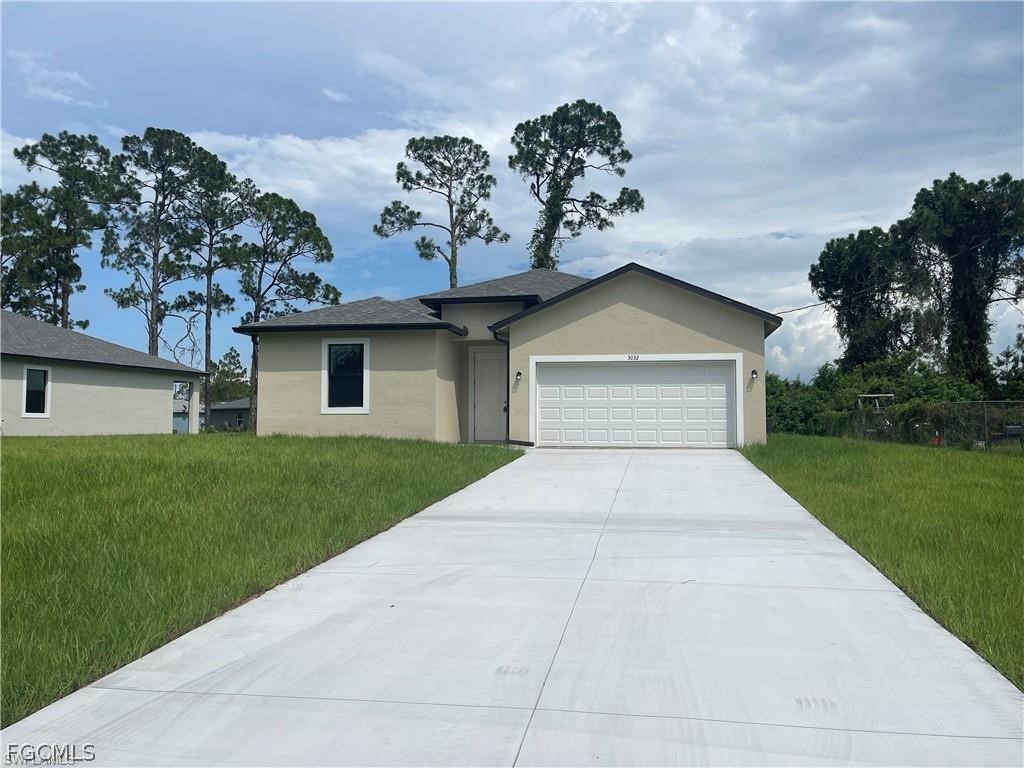 3032 West Briarwood Road LaBelle, FL 33935 - Photo 1 of 23 a view of a house with a yard