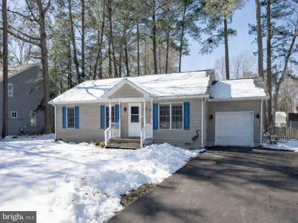 a view of a house with snow on the side of it