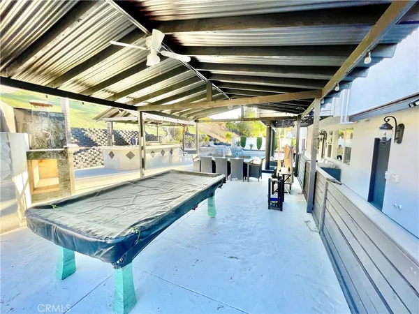 a view of swimming pool with seating area
