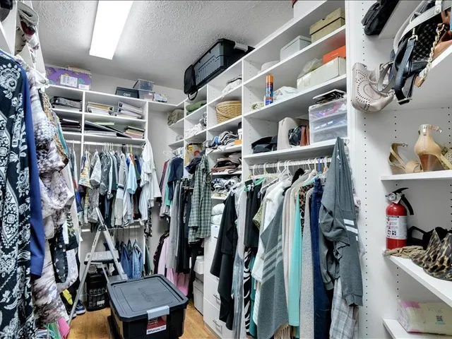 a bathroom with double vanity and a shower