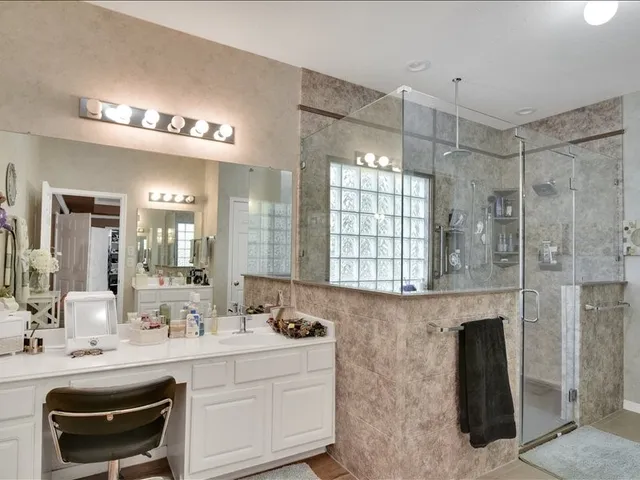 a bathroom with a sink vanity and a mirror