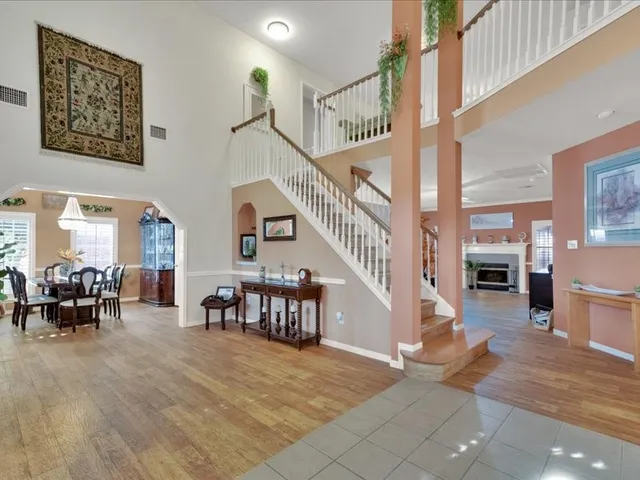a living room with furniture and white walls