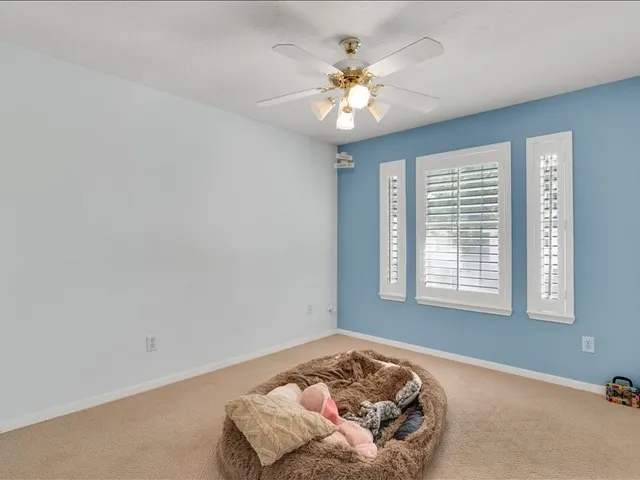 a bathroom with a double vanity sink mirror and shower