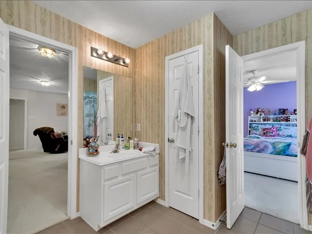 a bedroom with a bed and a tv