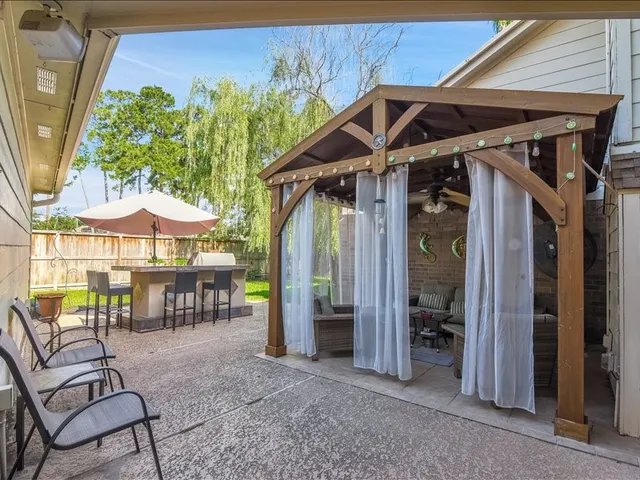 a outdoor living space with patio furniture and a potted plant