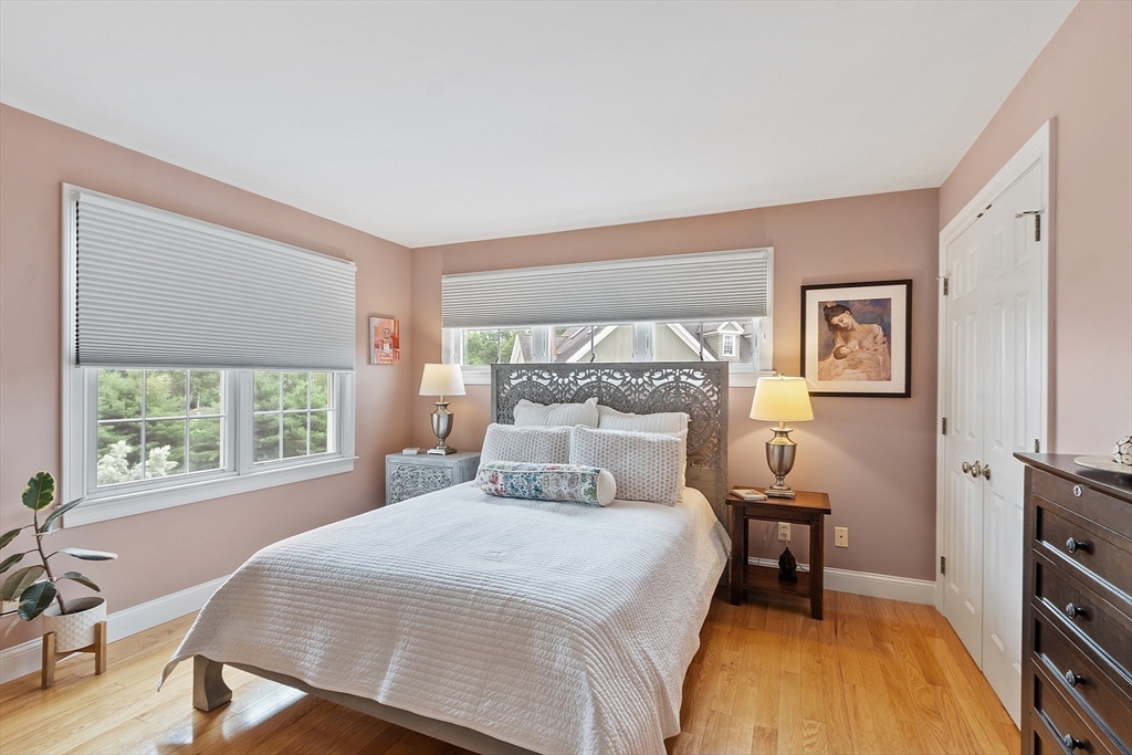 35 Lancaster County Road, Unit 7C Harvard, MA 01451 - Photo 16 of 33 a bedroom with a bed and a table in it with window