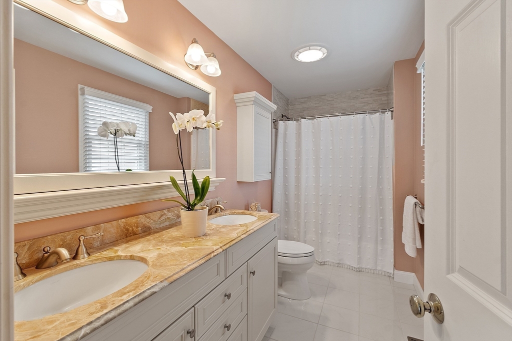 35 Lancaster County Road, Unit 7C Harvard, MA 01451 - Photo 19 of 33 a bathroom with a granite countertop sink a toilet and shower