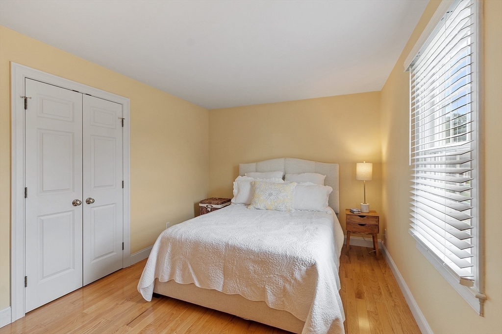 35 Lancaster County Road, Unit 7C Harvard, MA 01451 - Photo 20 of 33 a bedroom with a bed and a window