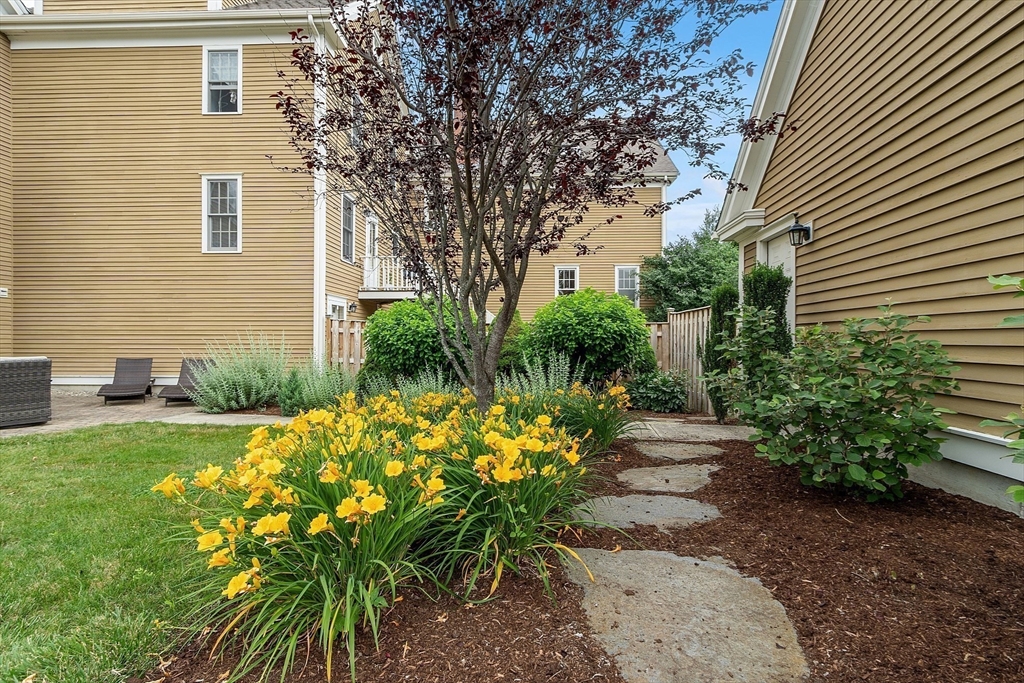 35 Lancaster County Road, Unit 7C Harvard, MA 01451 - Photo 30 of 33 a bunch of flowers in front of house