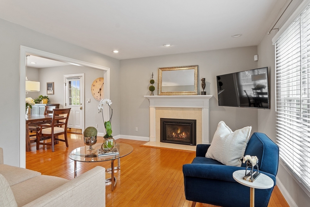 35 Lancaster County Road, Unit 7C Harvard, MA 01451 - Photo 5 of 33 a living room with furniture and a fireplace