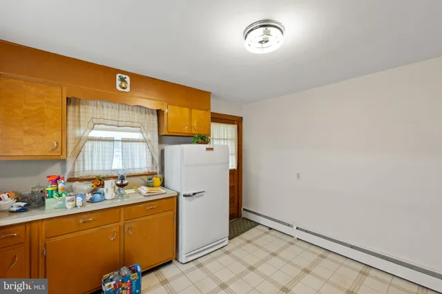 a storage room with wooden floor and window