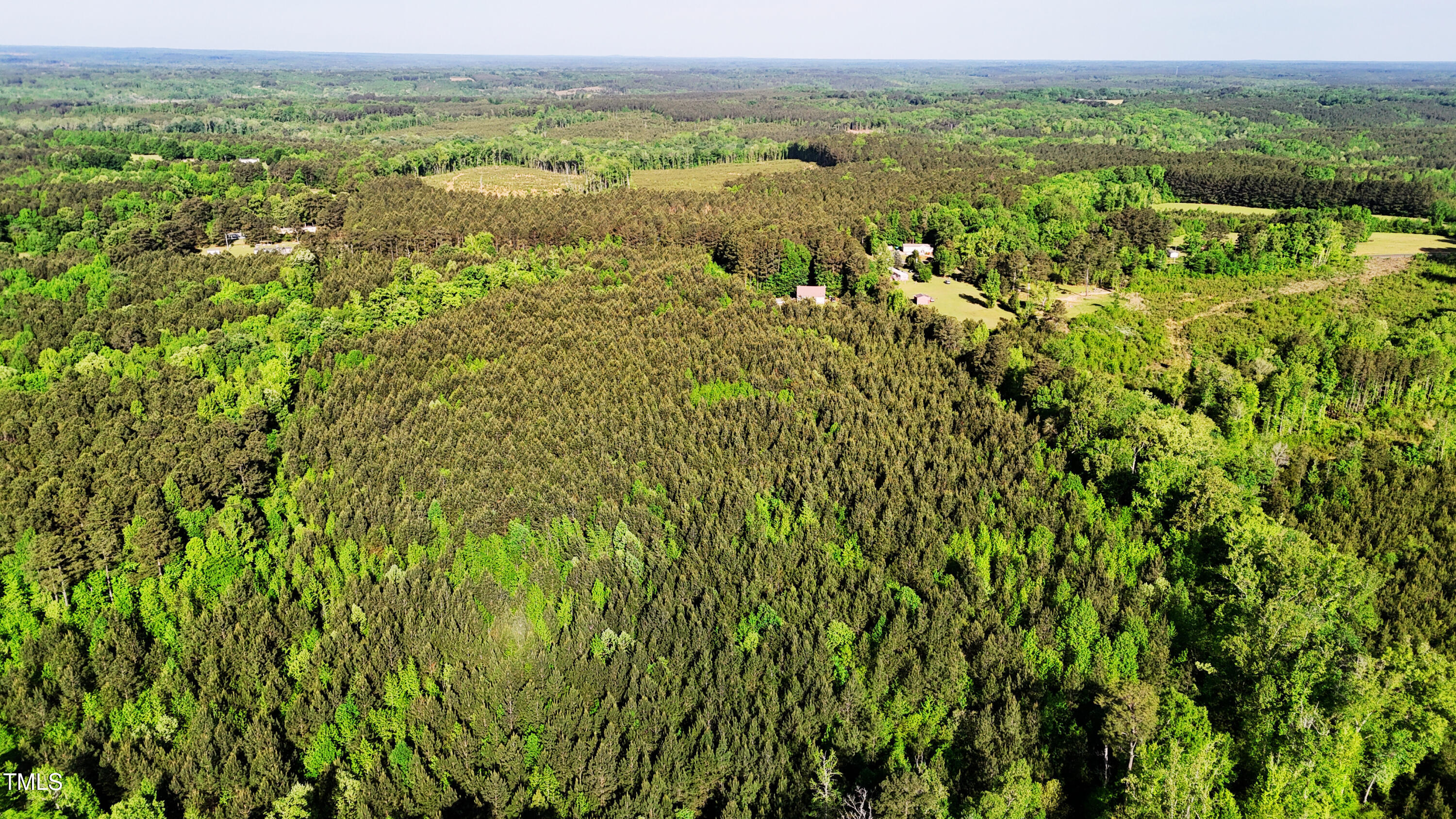 642 Breedlove Road Louisburg, NC 27549 - Photo 7 of 7 an aerial view of residential houses with outdoor space and trees