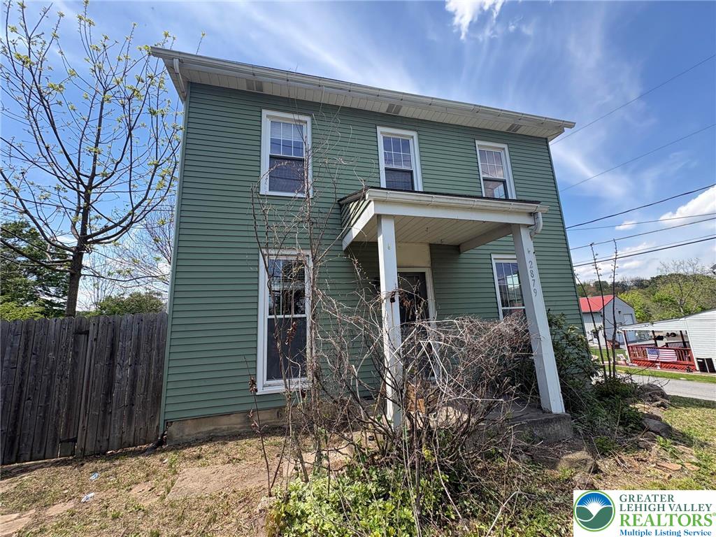 2879 Cemetery Street Slatington, PA 18080 - Photo 1 of 20 a front view of a house with garden