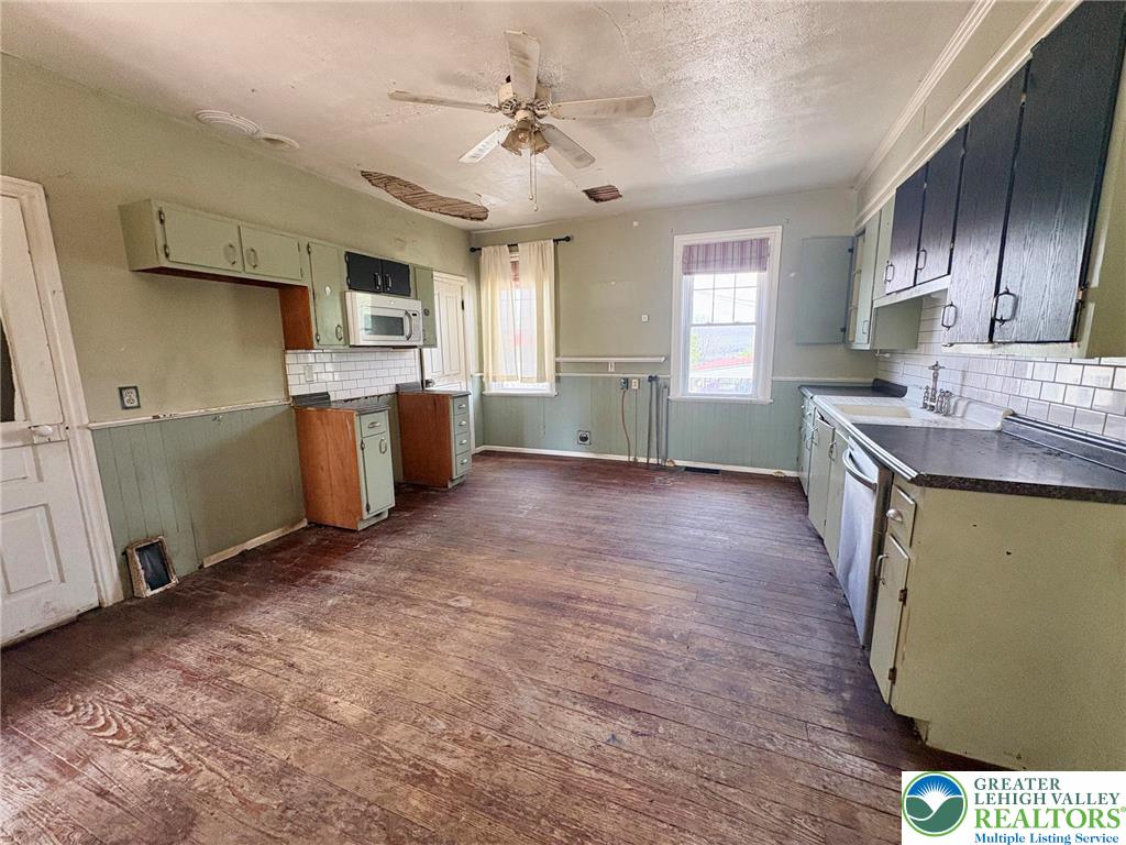 2879 Cemetery Street Slatington, PA 18080 - Photo 8 of 20 a kitchen with a sink stove and cabinets