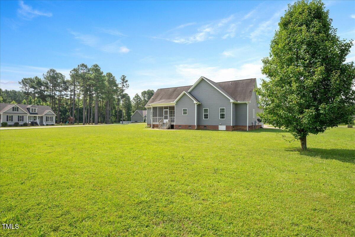 7326 Red Fox Road Bailey, NC 27807 - Photo 26 of 26 a front view of house with yard and green space