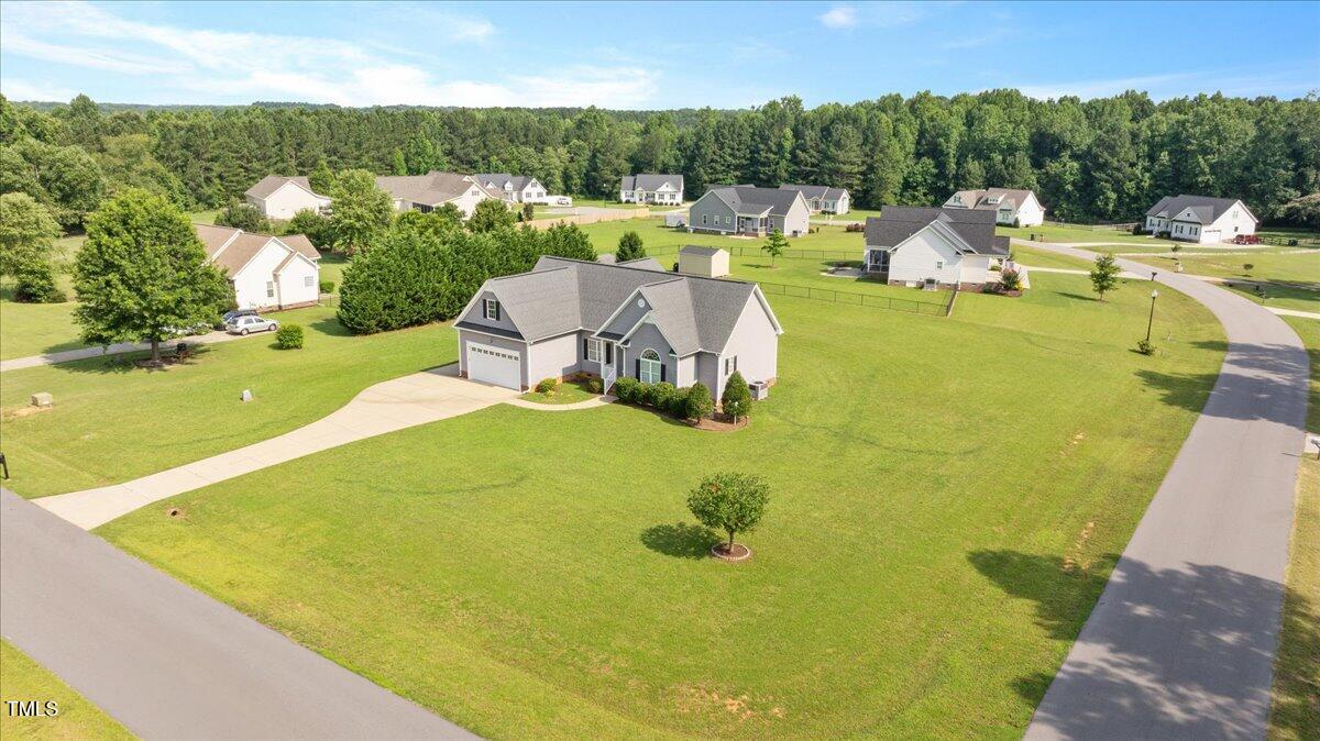 7326 Red Fox Road Bailey, NC 27807 - Photo 5 of 26 a view of a swimming pool with a patio and a yard