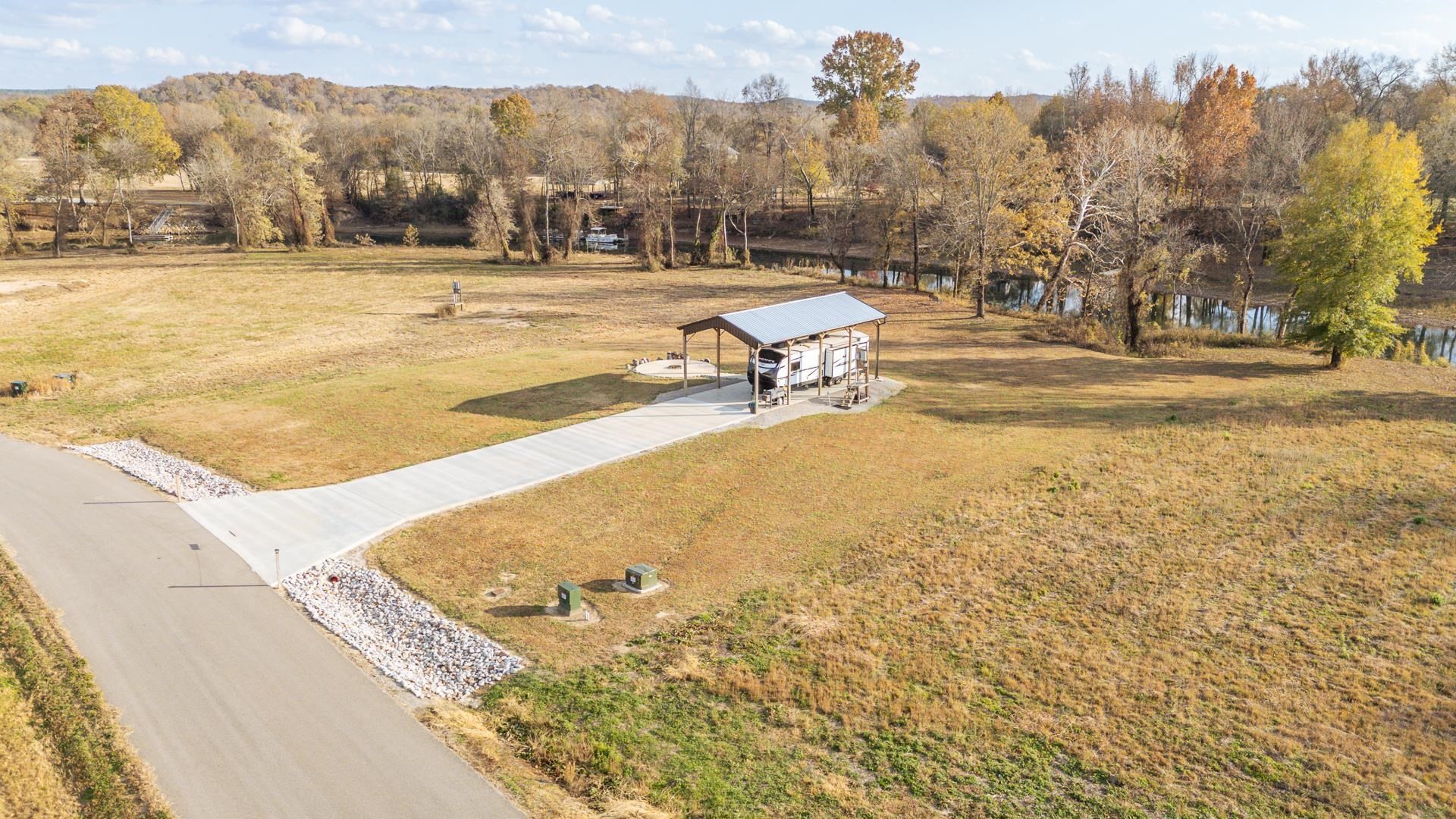 6425 Cravens Road Savannah, TN 38372 - Photo 3 of 39 a view of a swimming pool with a yard and mountain view