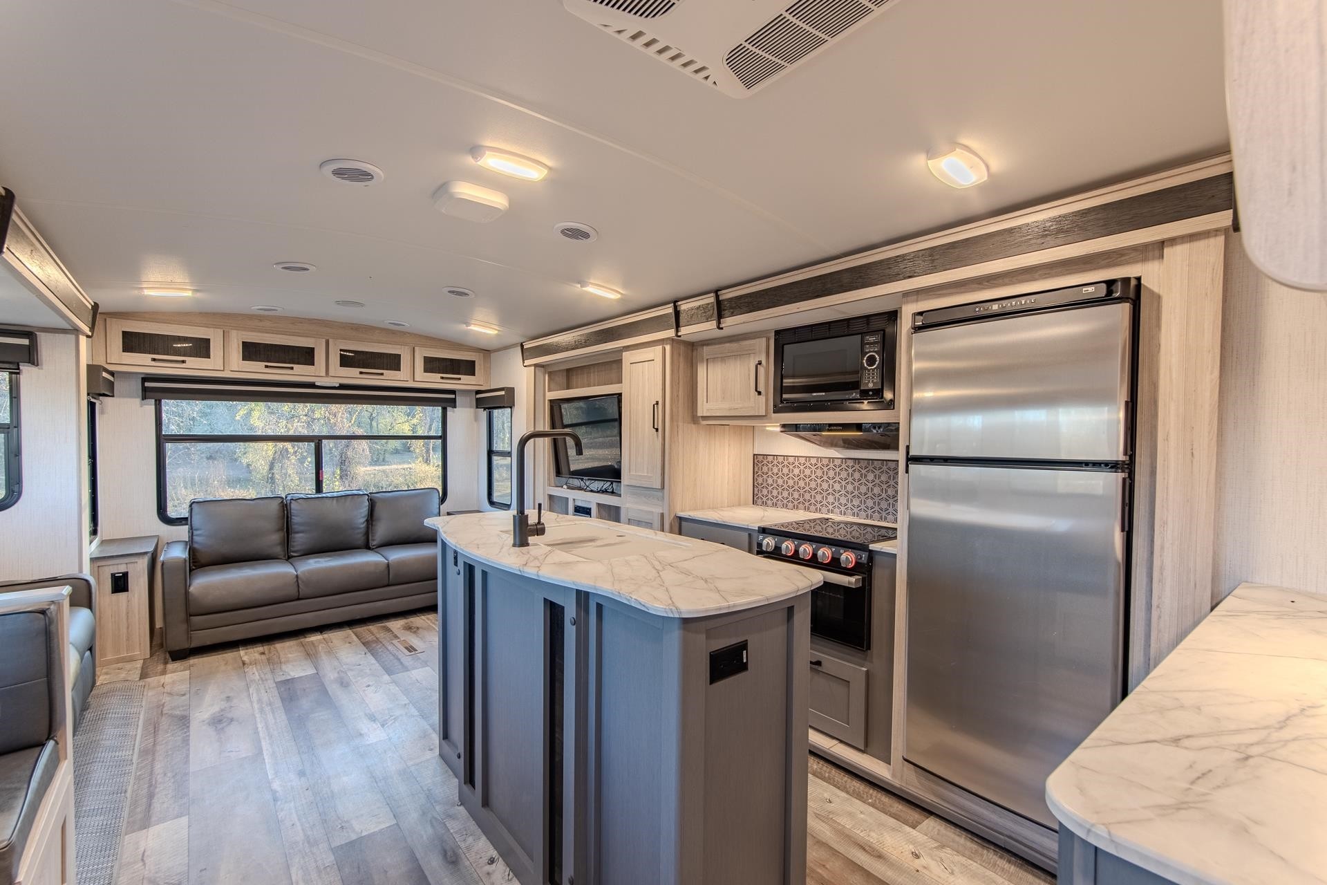 6425 Cravens Road Savannah, TN 38372 - Photo 31 of 39 a kitchen with a refrigerator and a couch