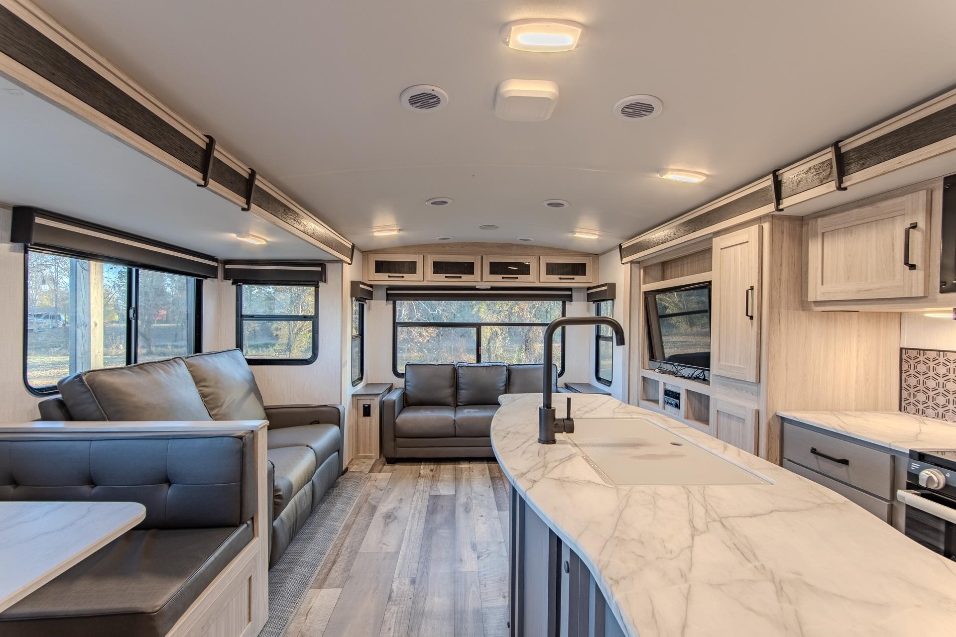 6425 Cravens Road Savannah, TN 38372 - Photo 36 of 39 a living room with furniture and a flat screen tv