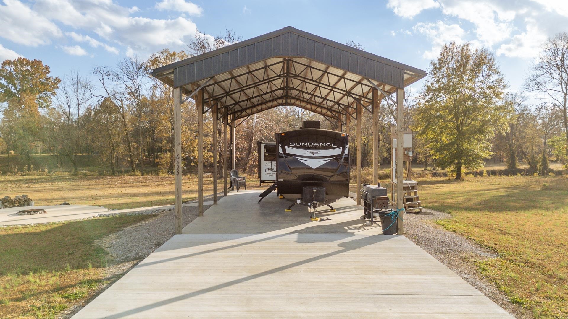 6425 Cravens Road Savannah, TN 38372 - Photo 4 of 39 a view of a swimming pool with an outdoor seating