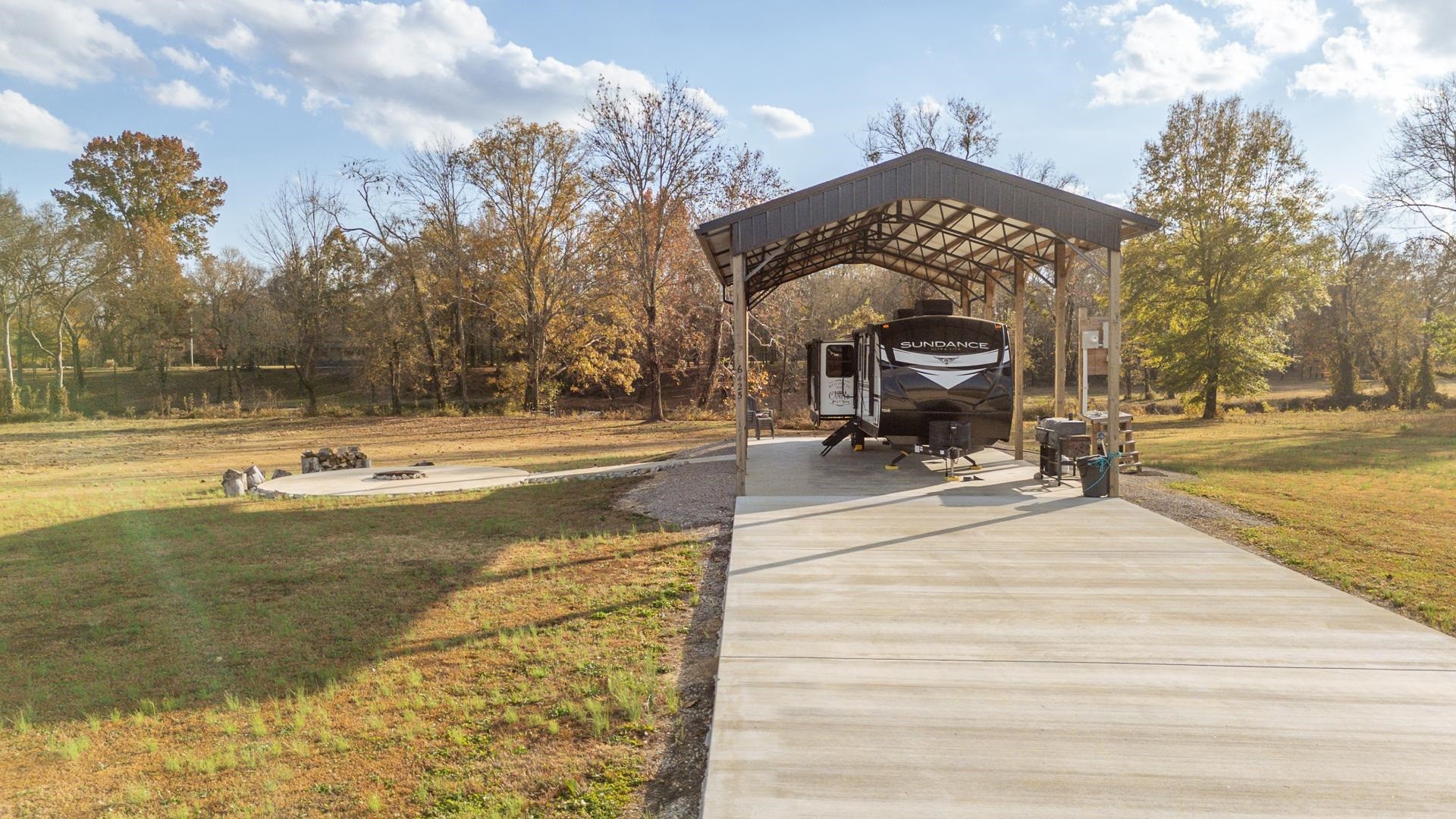 6425 Cravens Road Savannah, TN 38372 - Photo 5 of 39 a view of a swimming pool with an outdoor space