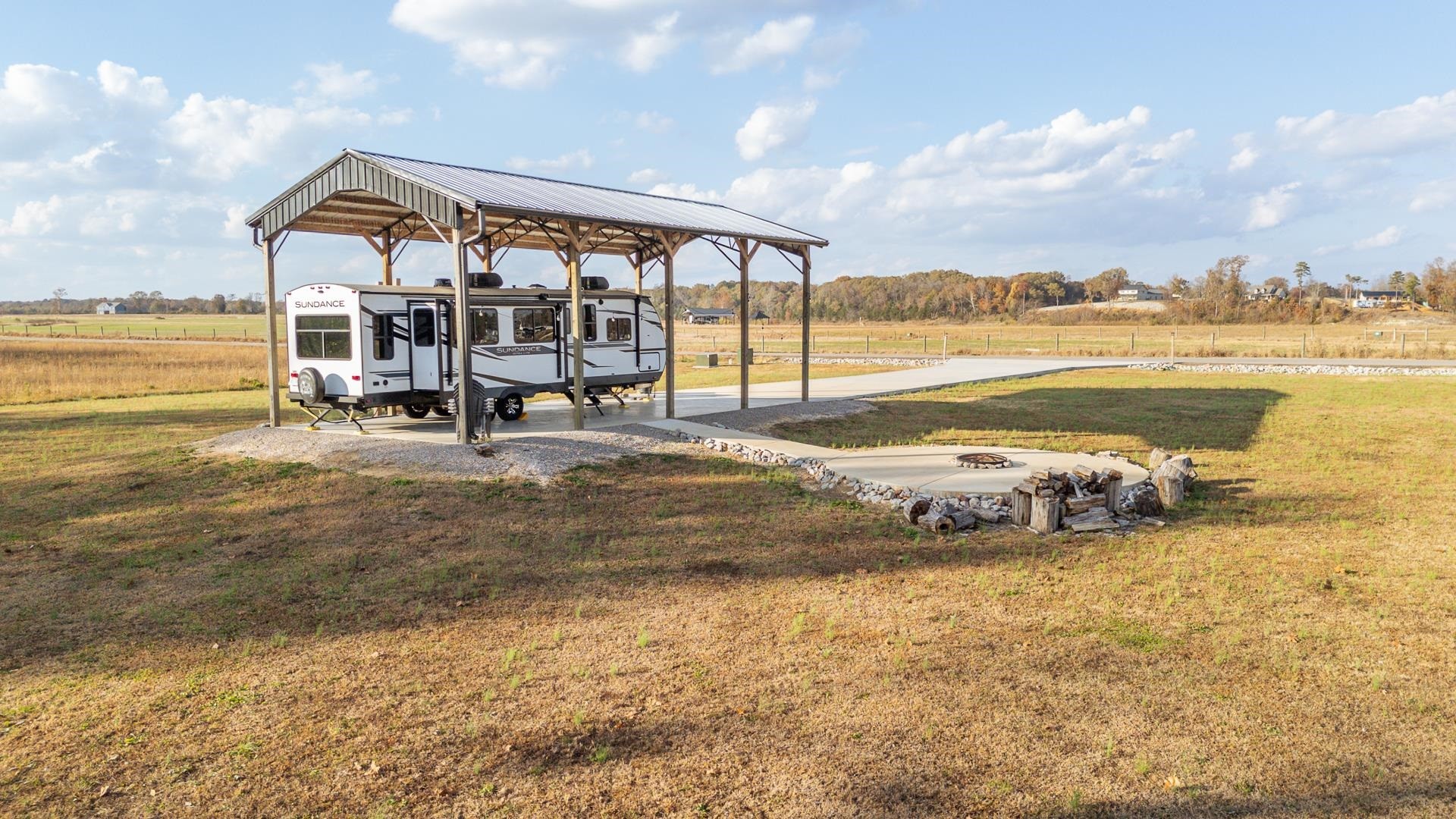 6425 Cravens Road Savannah, TN 38372 - Photo 7 of 39 a view of a lake with a car parked
