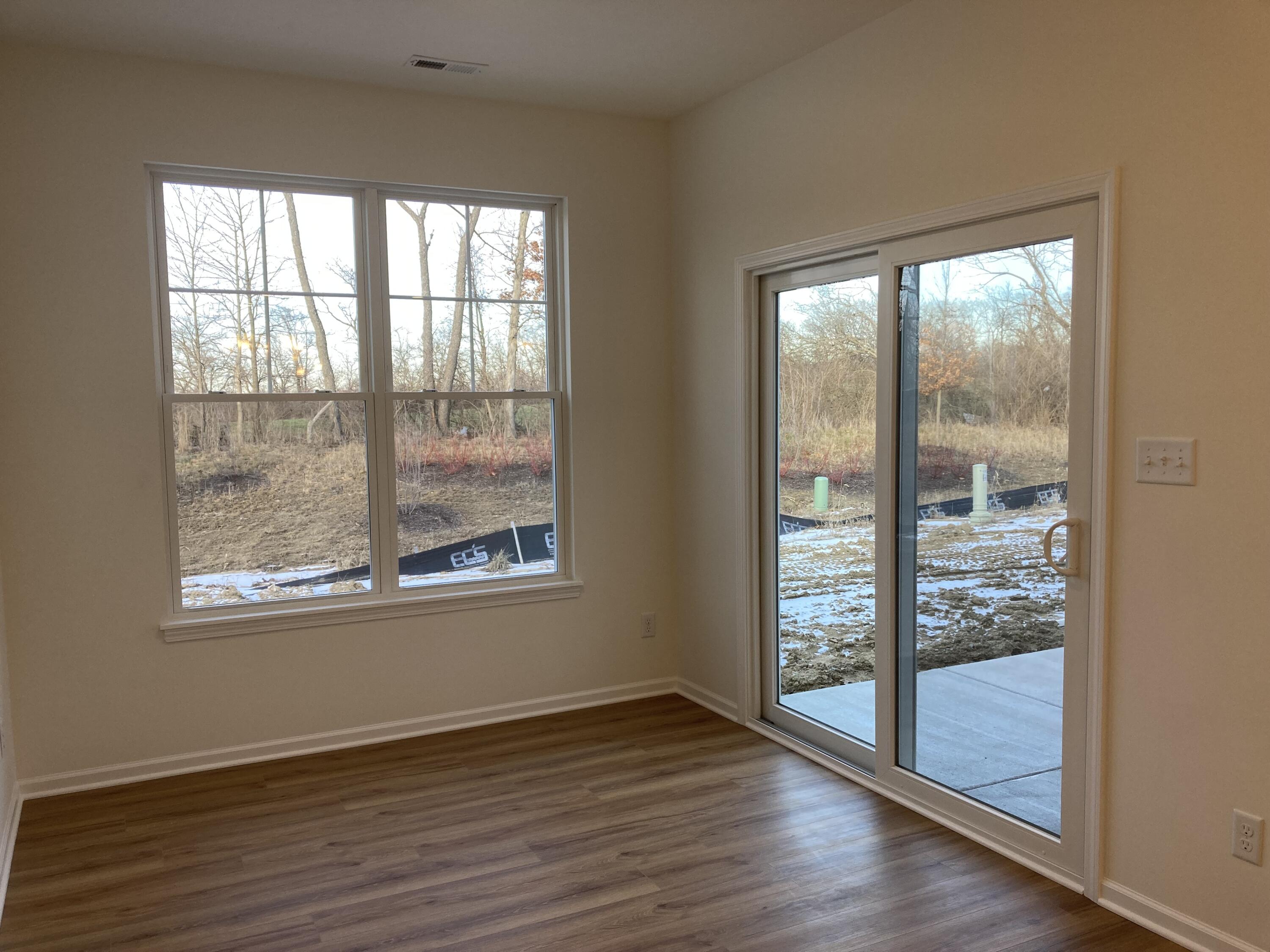 4250 Reflection Place Valparaiso, IN 46385 - Photo 12 of 12 an empty room with wooden floor and windows