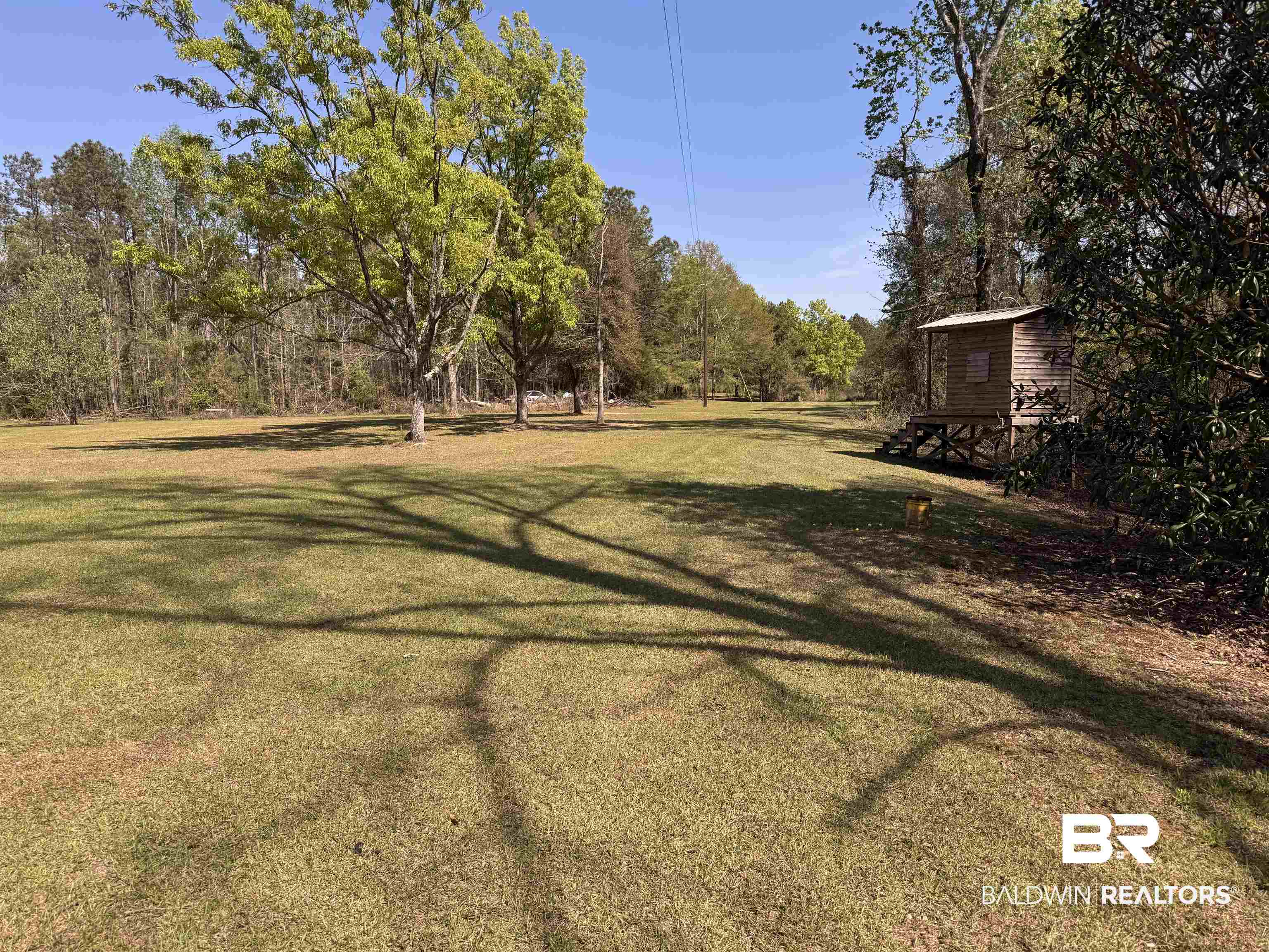 516 Mill Creek Road Frisco City, AL 36445 - Photo 26 of 32 View of green lawn