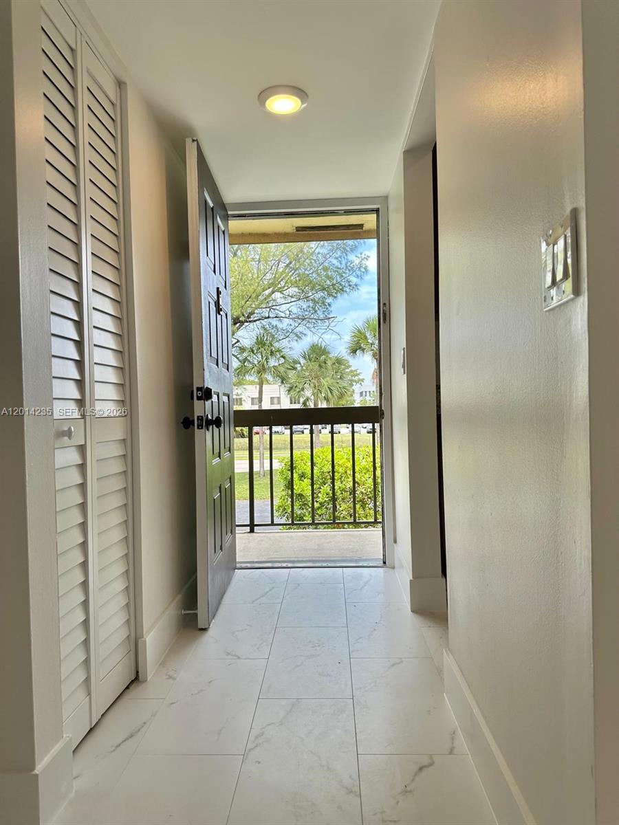 21911 Lake Forest Circle, Unit 202 Boca Raton, FL 33433 - Photo 12 of 14 a view of an empty room with a window
