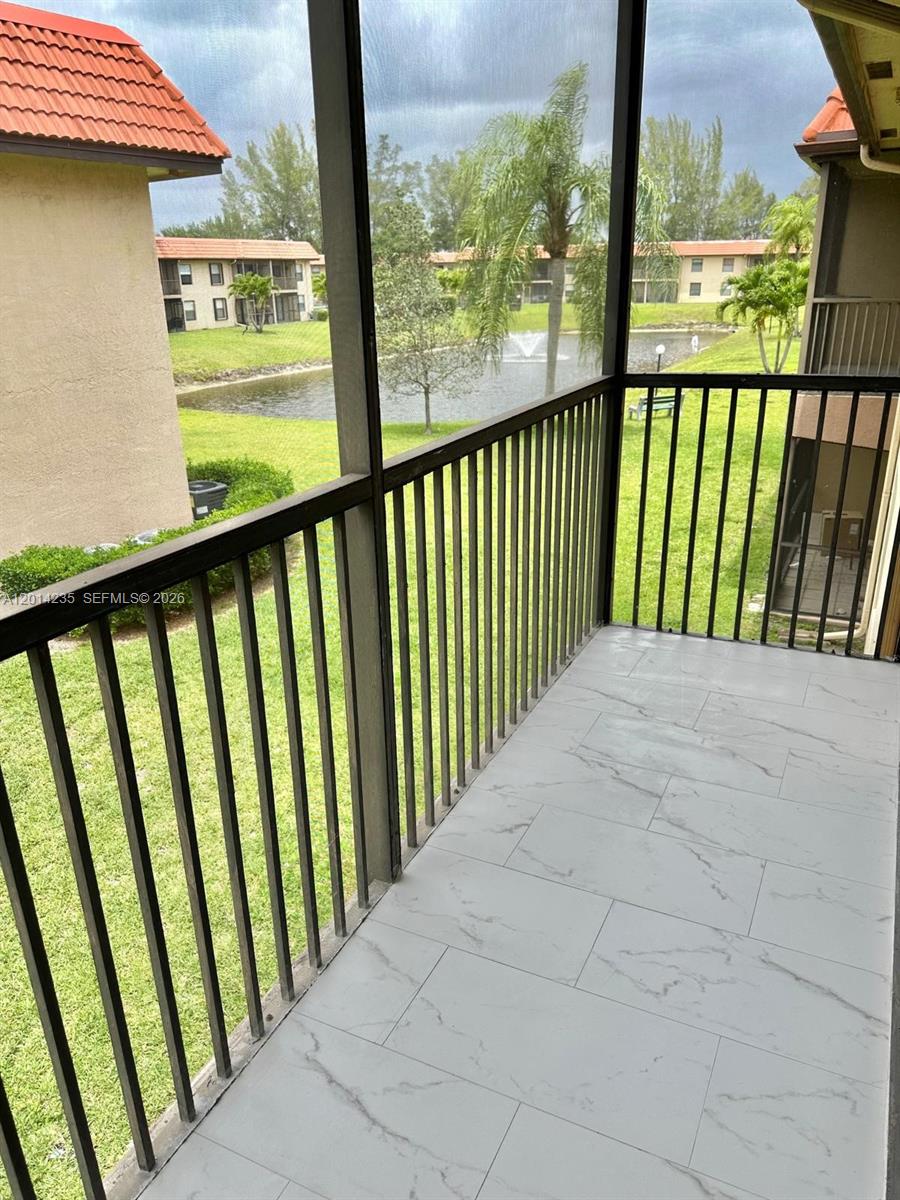 21911 Lake Forest Circle, Unit 202 Boca Raton, FL 33433 - Photo 13 of 14 a view of balcony with floor