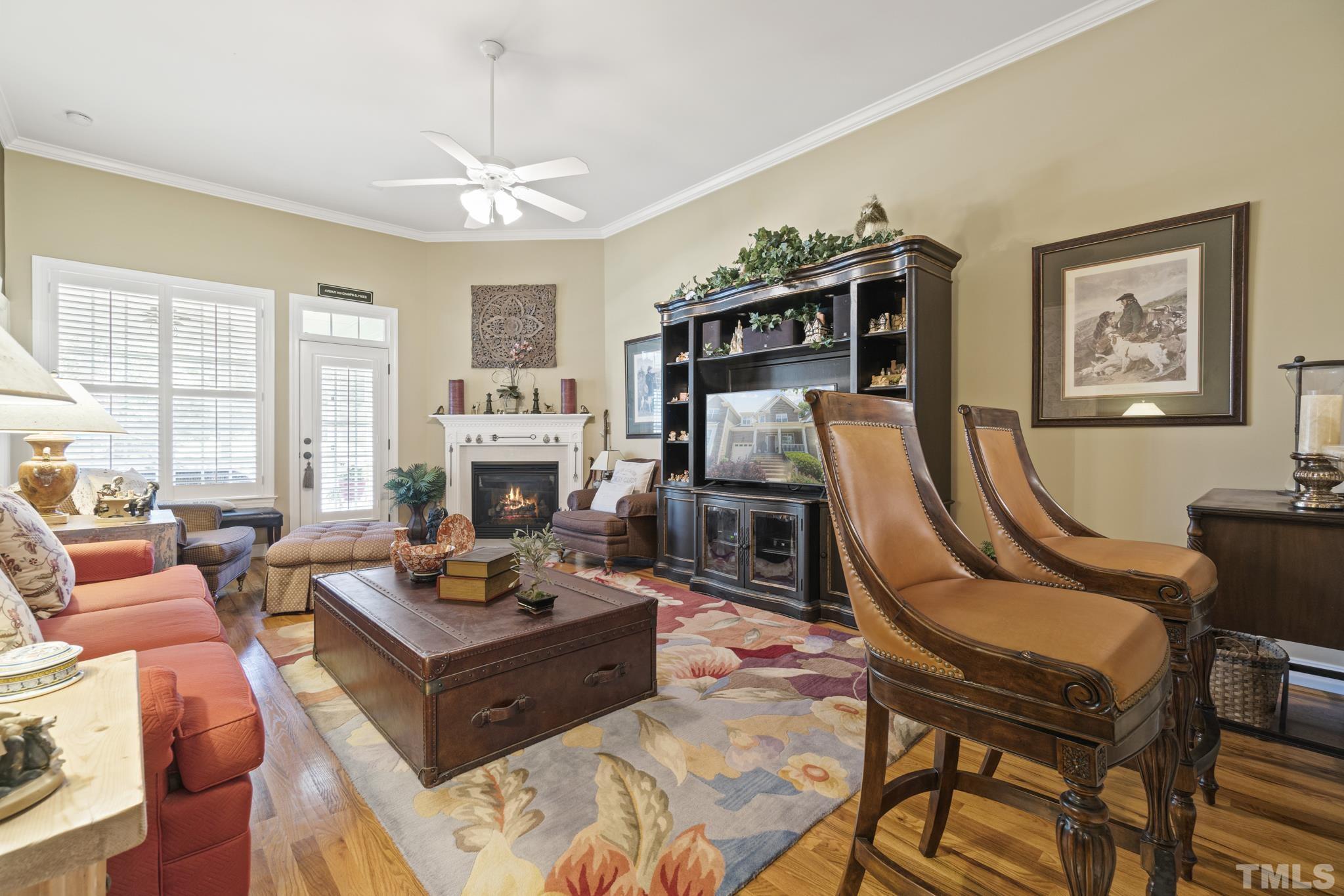 641 Canvas Drive Wake Forest, NC 27587 - Photo 14 of 37 a living room with furniture a fireplace and a large window