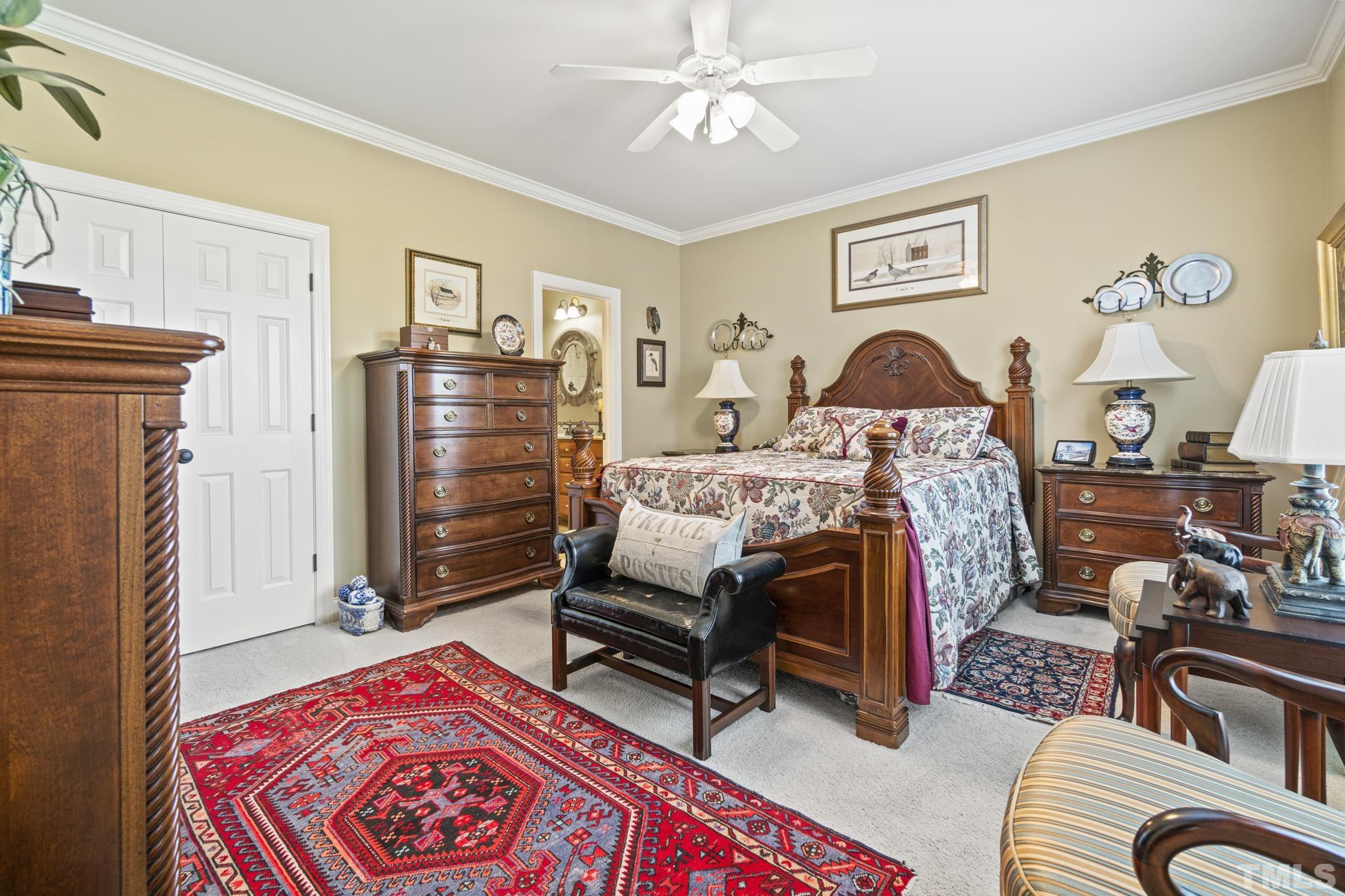 641 Canvas Drive Wake Forest, NC 27587 - Photo 17 of 37 a bedroom with furniture and a fireplace