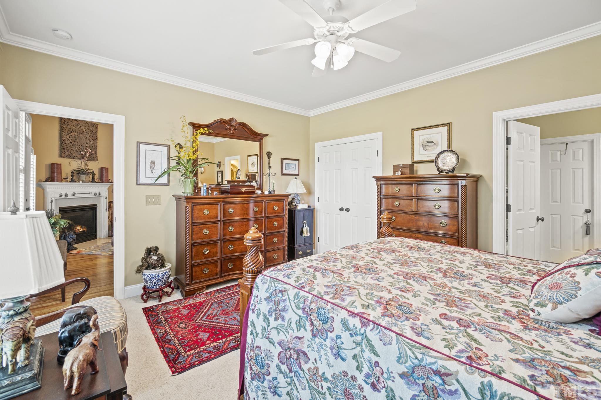 641 Canvas Drive Wake Forest, NC 27587 - Photo 18 of 37 a bedroom with a bed and dresser with wooden floor