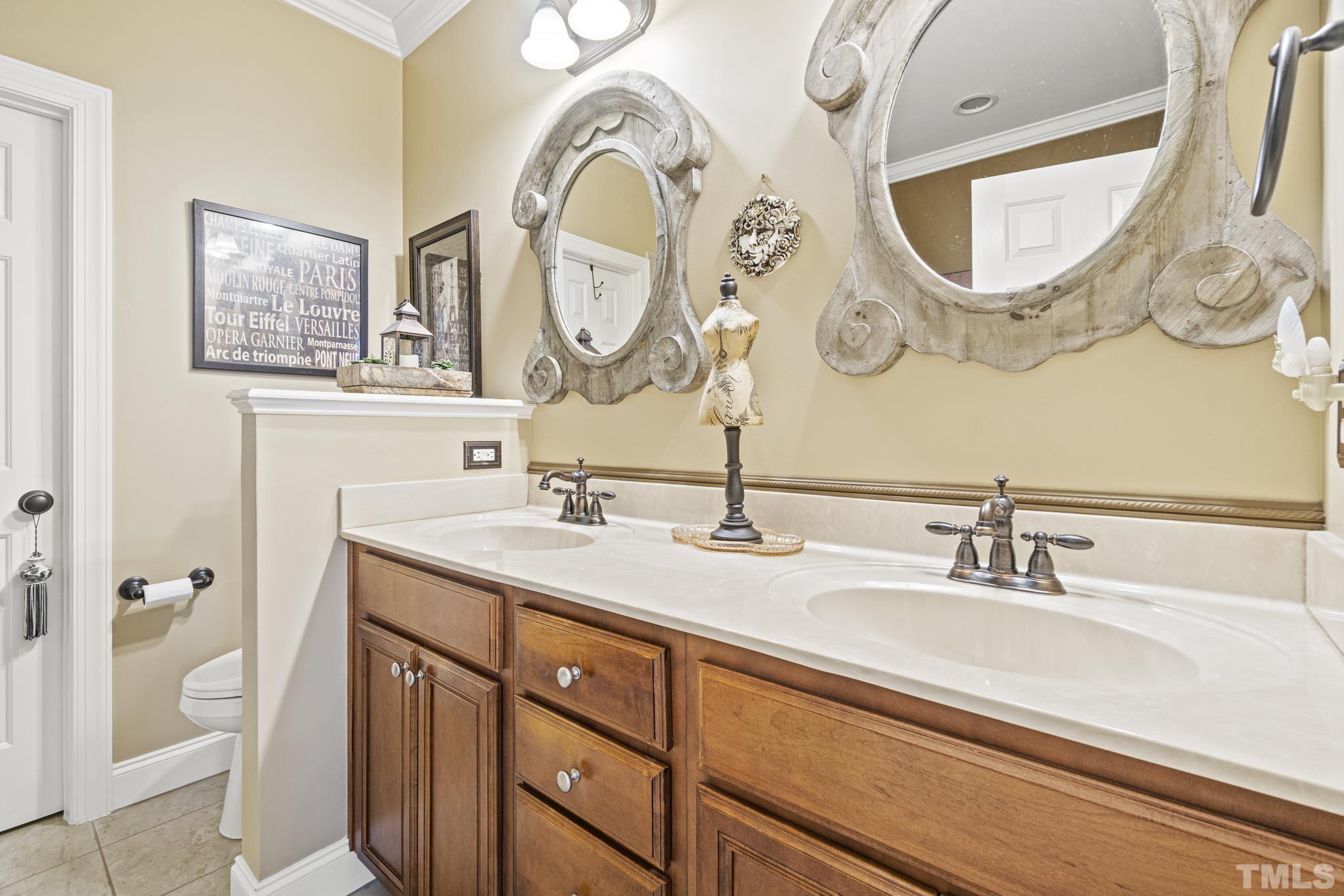 641 Canvas Drive Wake Forest, NC 27587 - Photo 19 of 37 a bathroom with a granite countertop double vanity sink and a mirror
