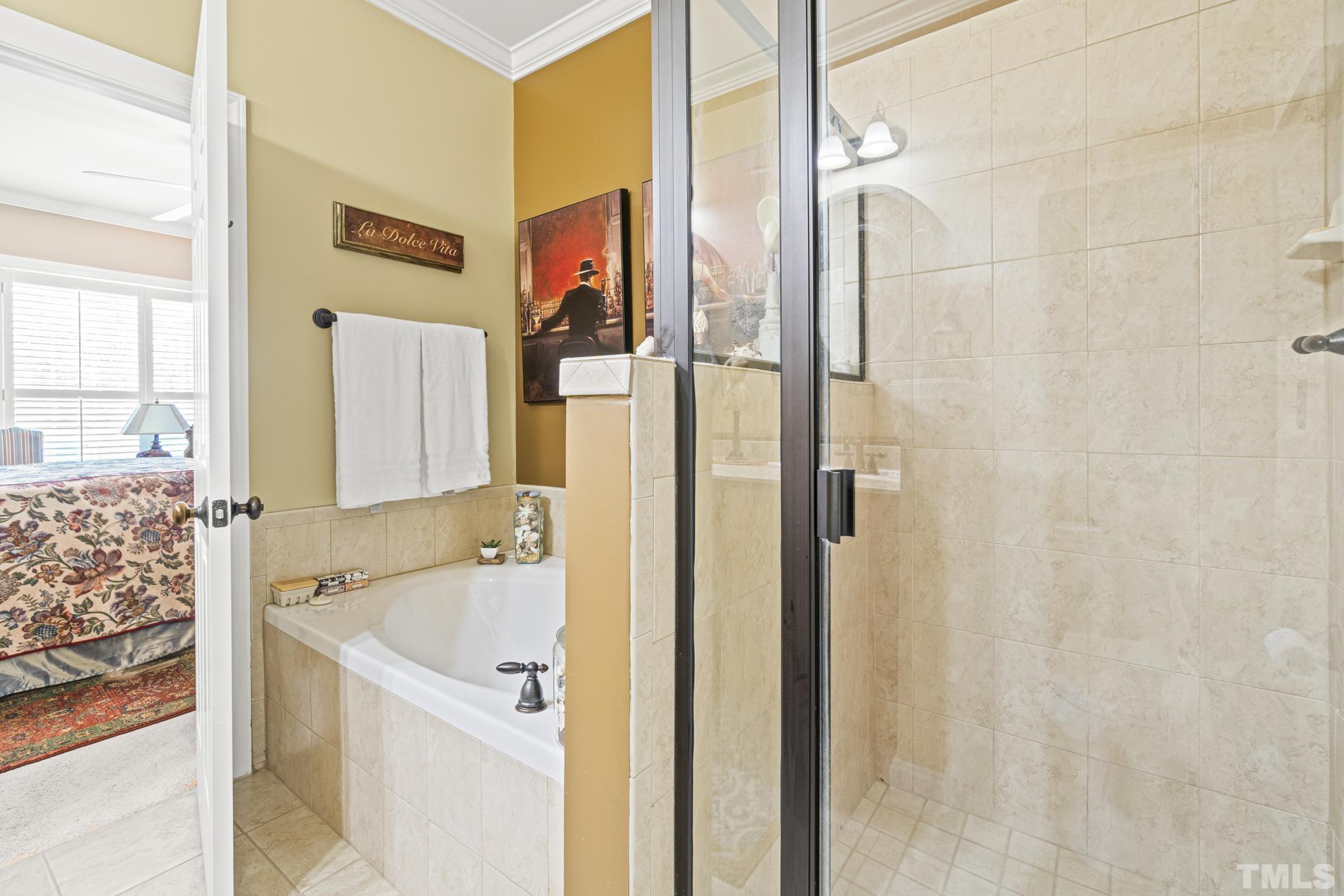 641 Canvas Drive Wake Forest, NC 27587 - Photo 20 of 37 a bathroom with a tub and shower
