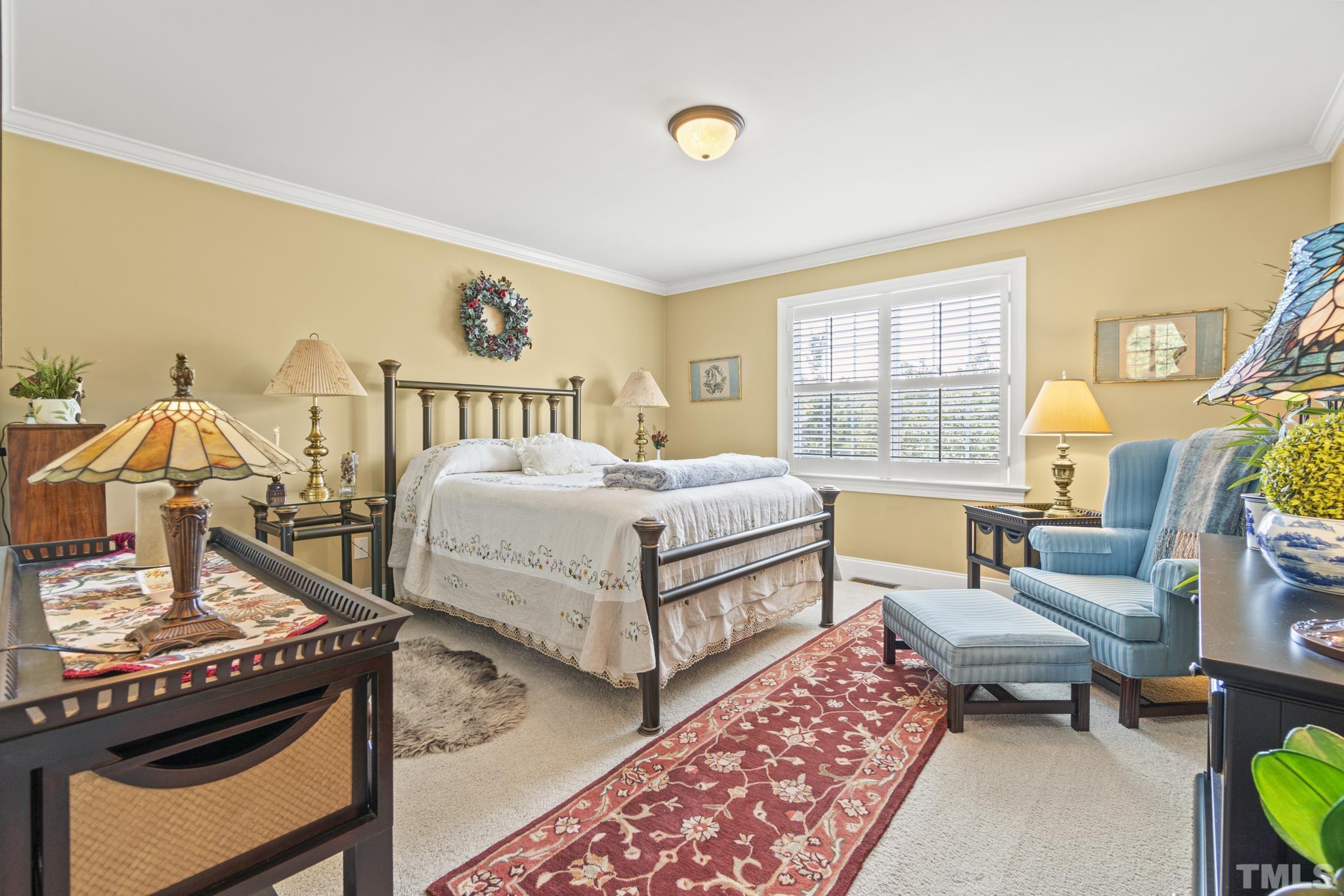 641 Canvas Drive Wake Forest, NC 27587 - Photo 25 of 37 a bedroom with a bed a bookshelf and a dresser next to a window