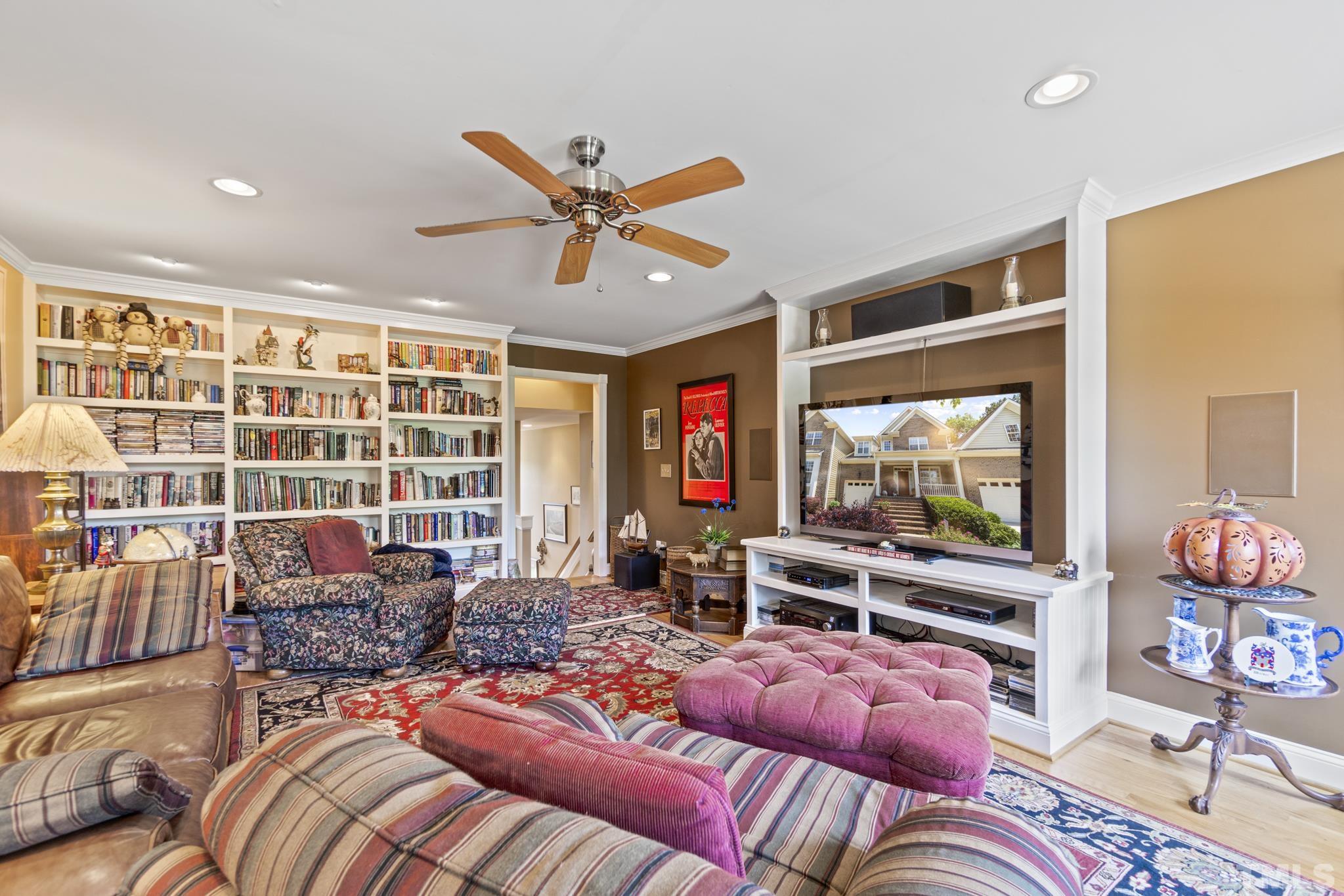 641 Canvas Drive Wake Forest, NC 27587 - Photo 28 of 37 a living room with furniture and a flat screen tv