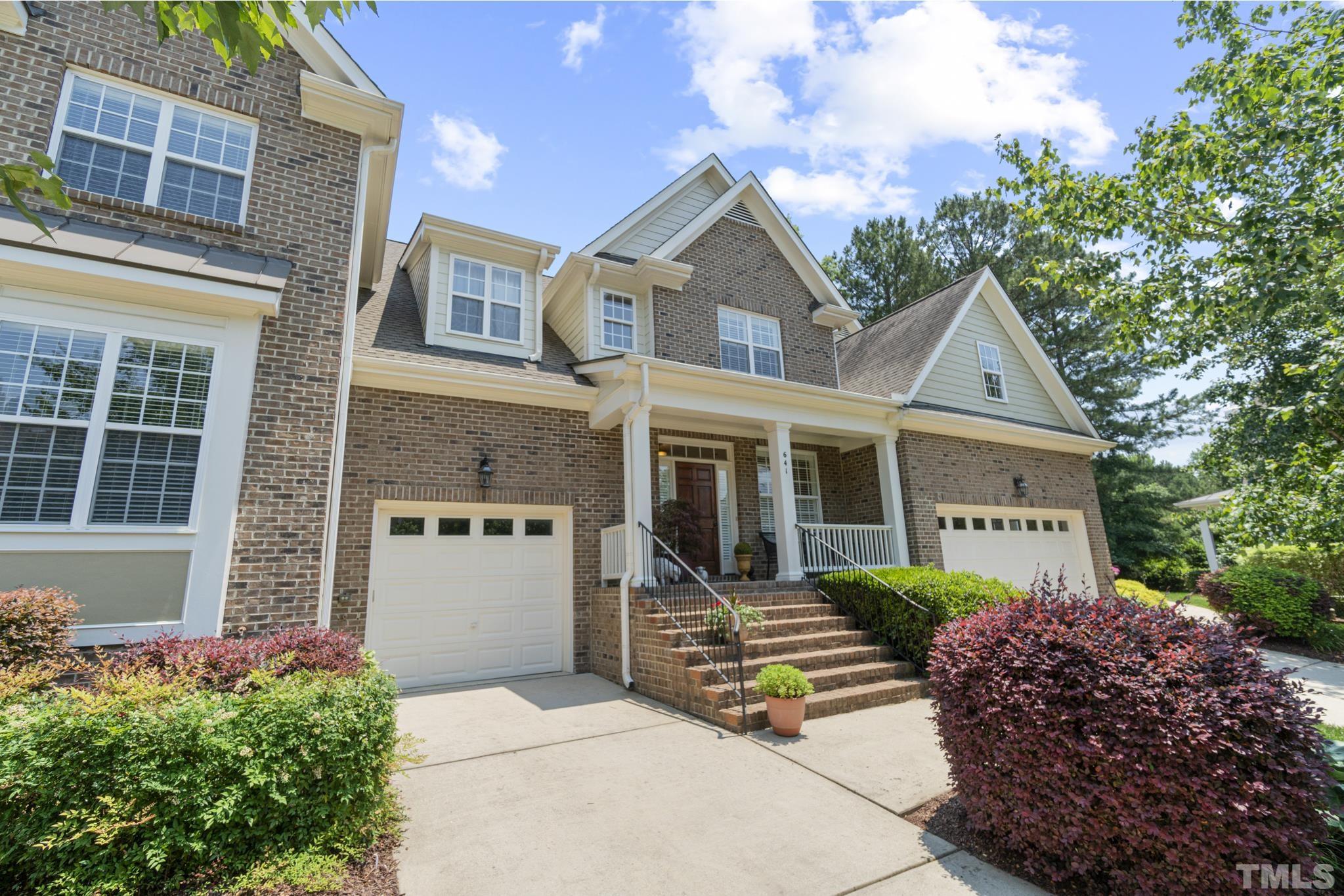 641 Canvas Drive Wake Forest, NC 27587 - Photo 35 of 37 a front view of a house with a garden