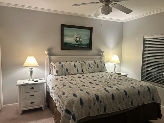 a bathroom with a sink mirror and toilet