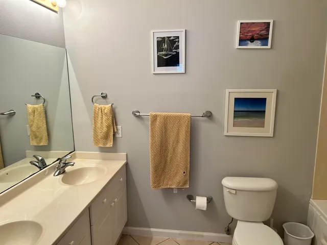 a bedroom with a bed and a lamp