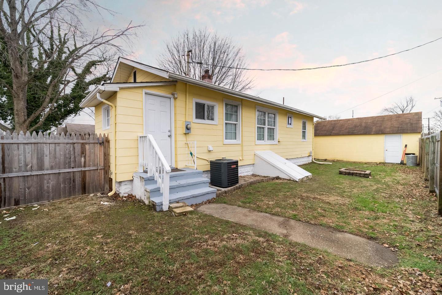 252 G Street Carneys Point, NJ 08069 - Photo 6 of 8 a view of a house with backyard