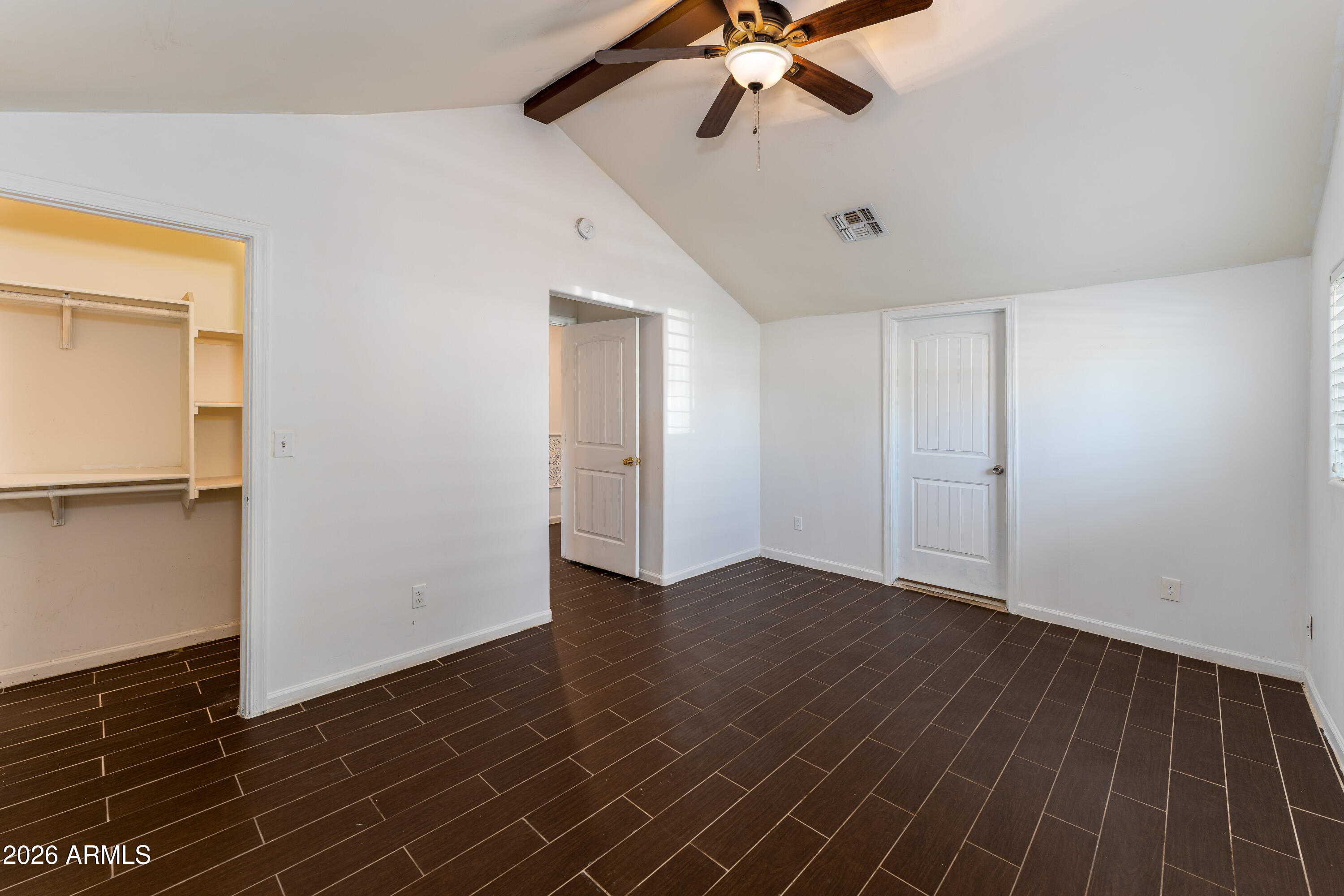 9616 North 11th Avenue Phoenix, AZ 85021 - Photo 15 of 32 a view of an empty room with wooden floor
