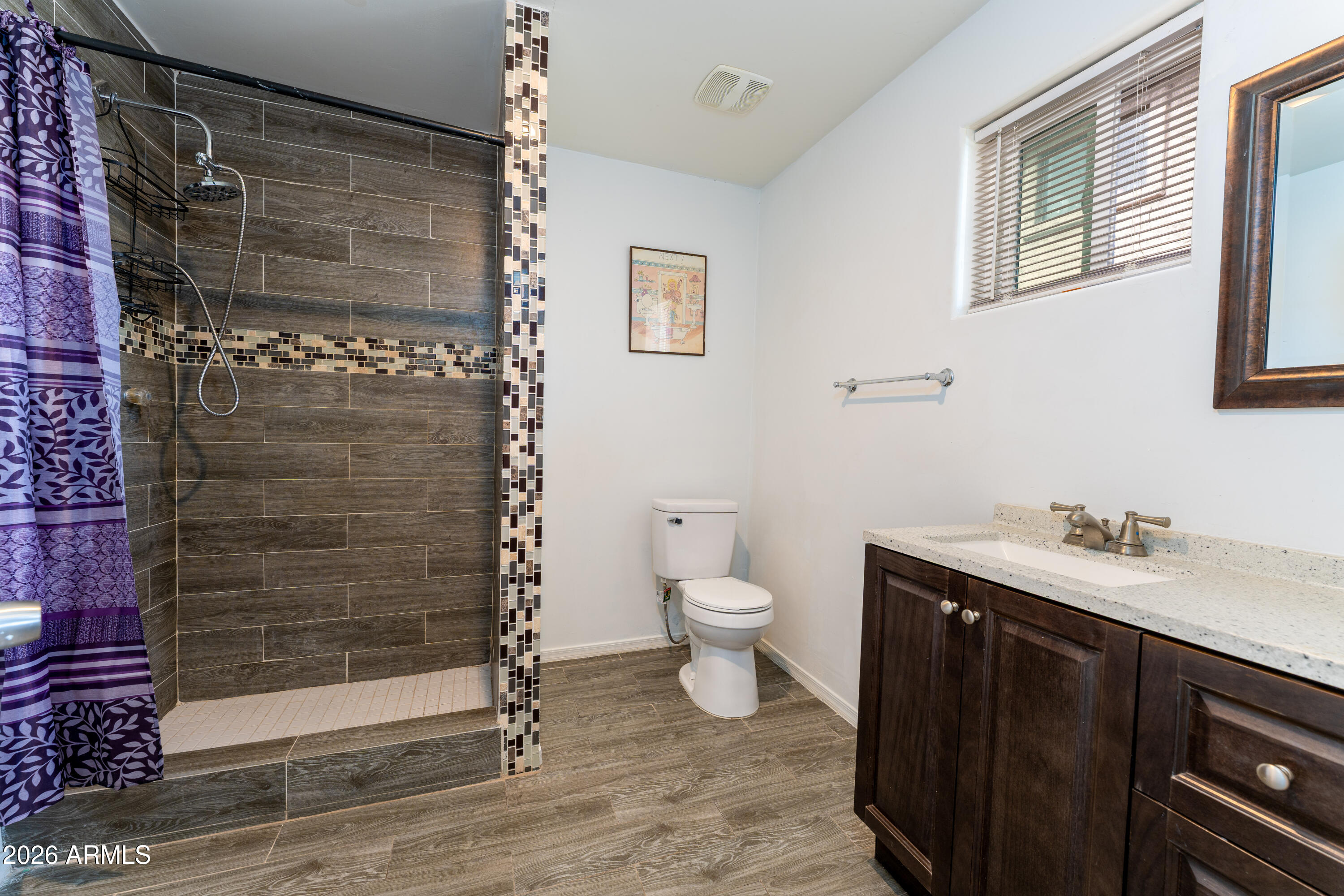 9616 North 11th Avenue Phoenix, AZ 85021 - Photo 16 of 32 a bathroom with a sink toilet and shower